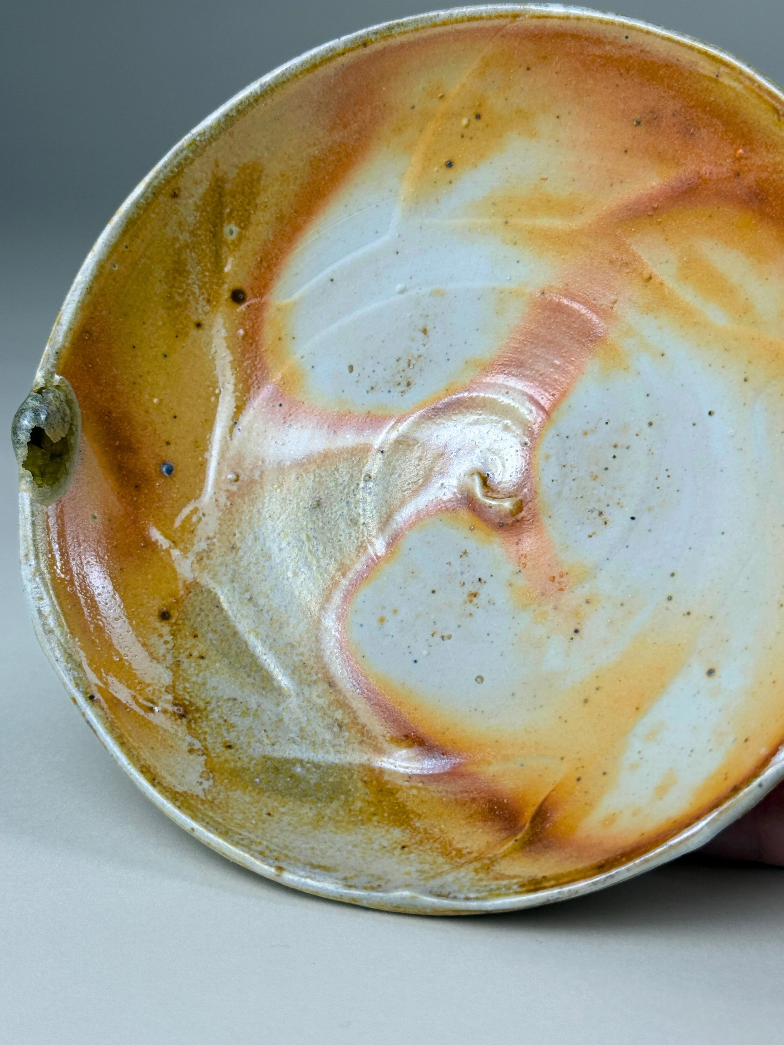Empty ice cream cup with remnants of caramel and vanilla ice cream
