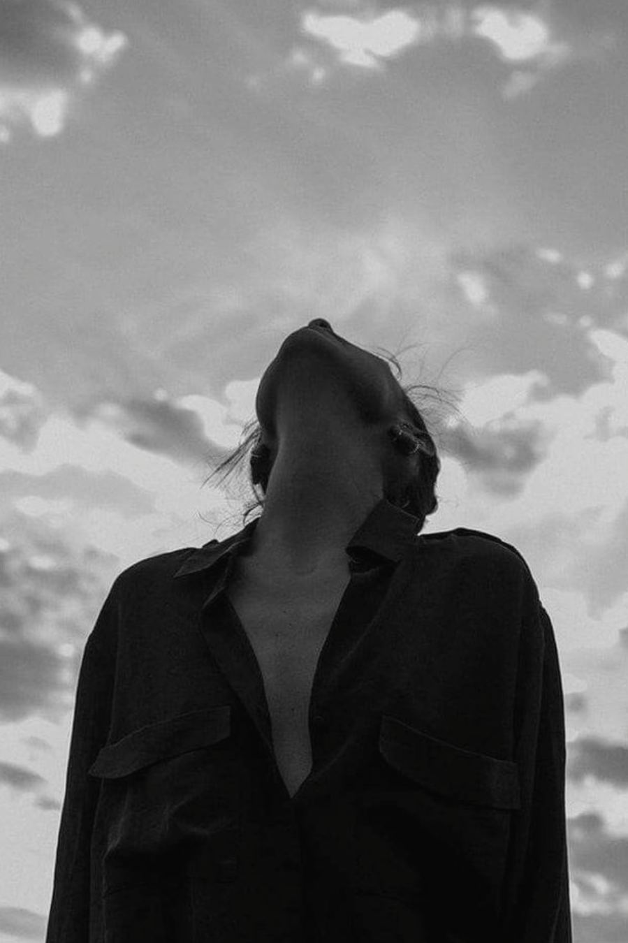 graphic of a woman looking up at the sky wearing a dark coloured shirt