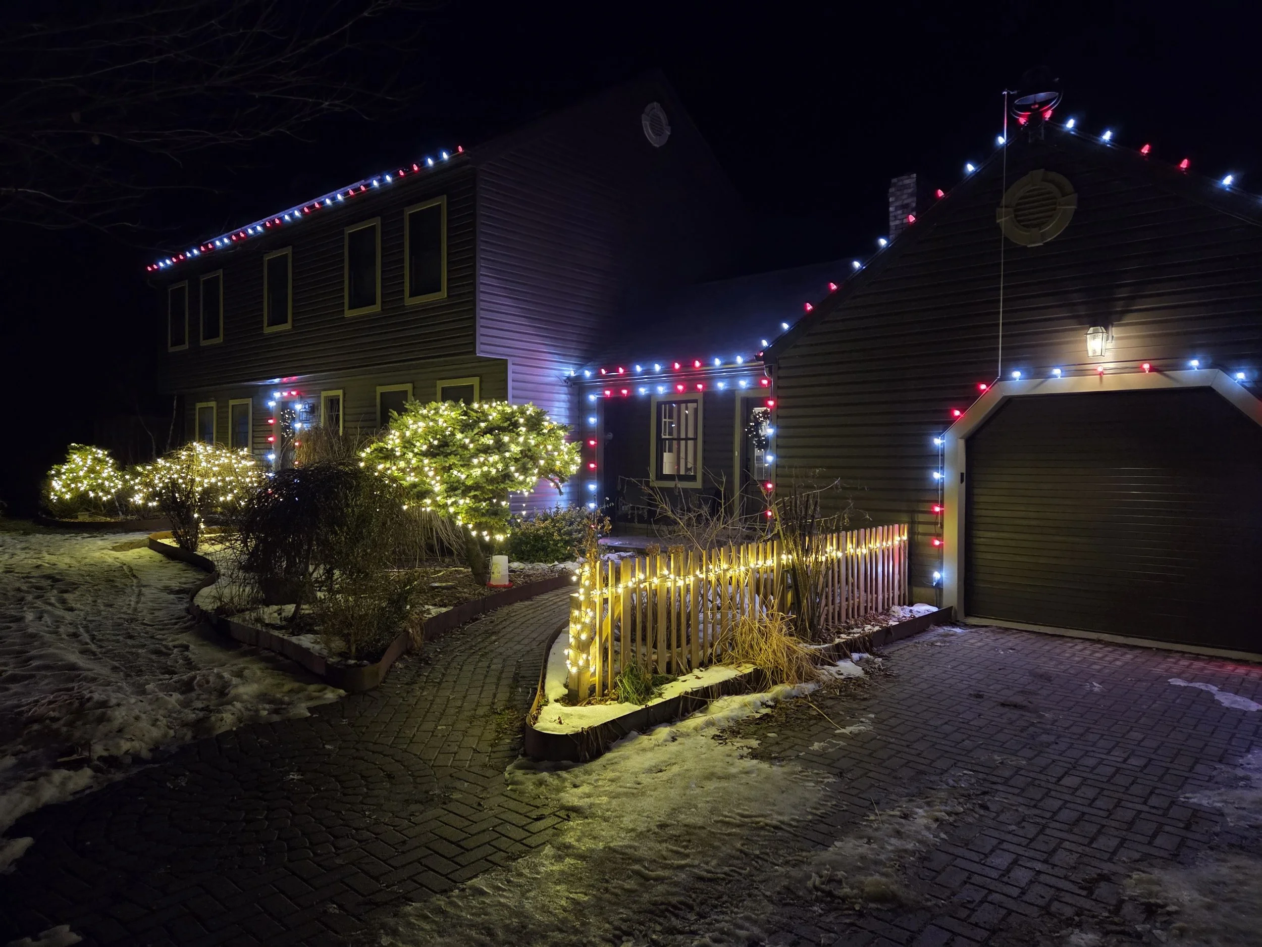 Christmas light installation in Fort Erie with clean cool-white LED roofline lights on a modern two-story home — Niagara Glow Pros.