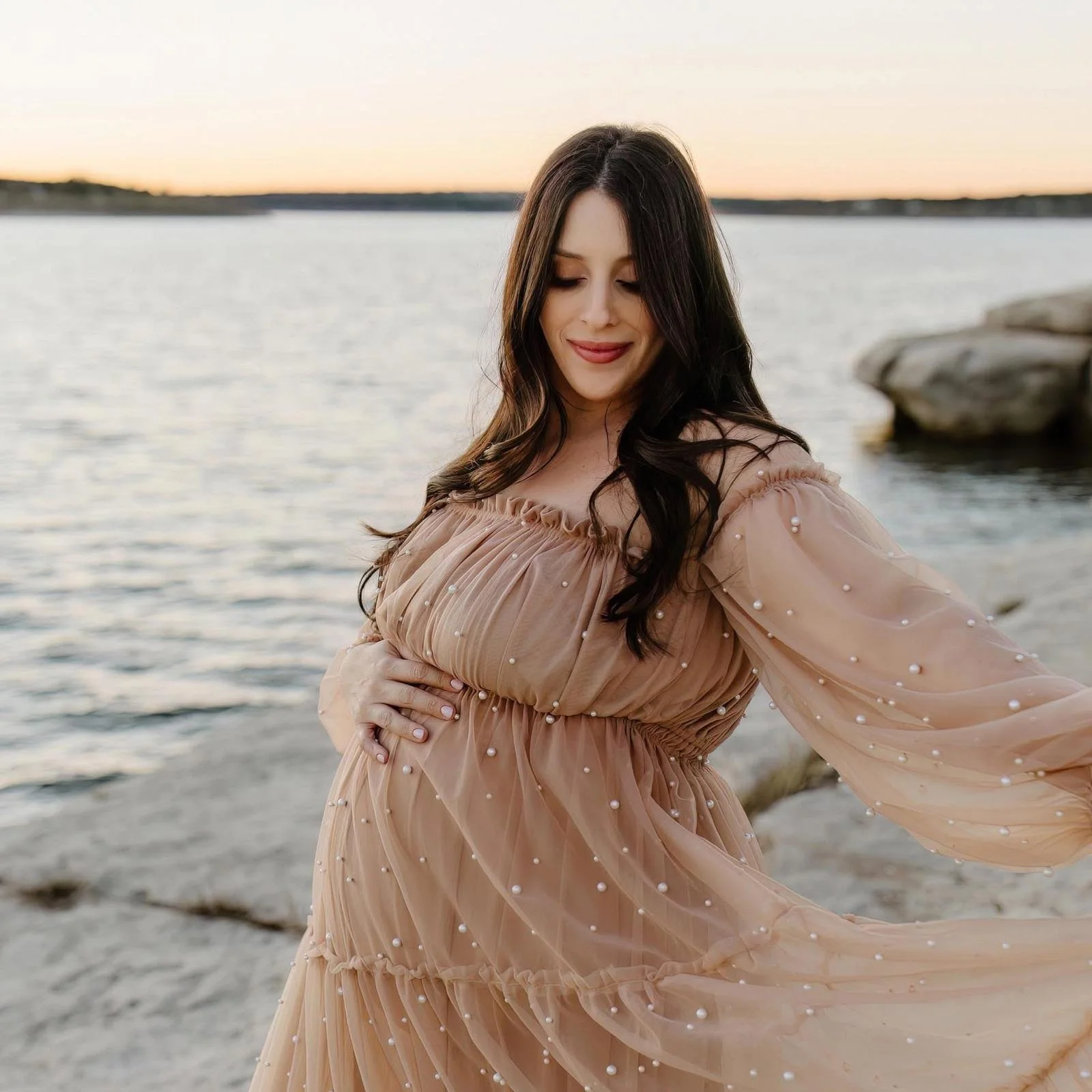 Chelsea, founder of Motherwell, in a maternity portrait taken near a lake in Austin and Cedar Park, TX