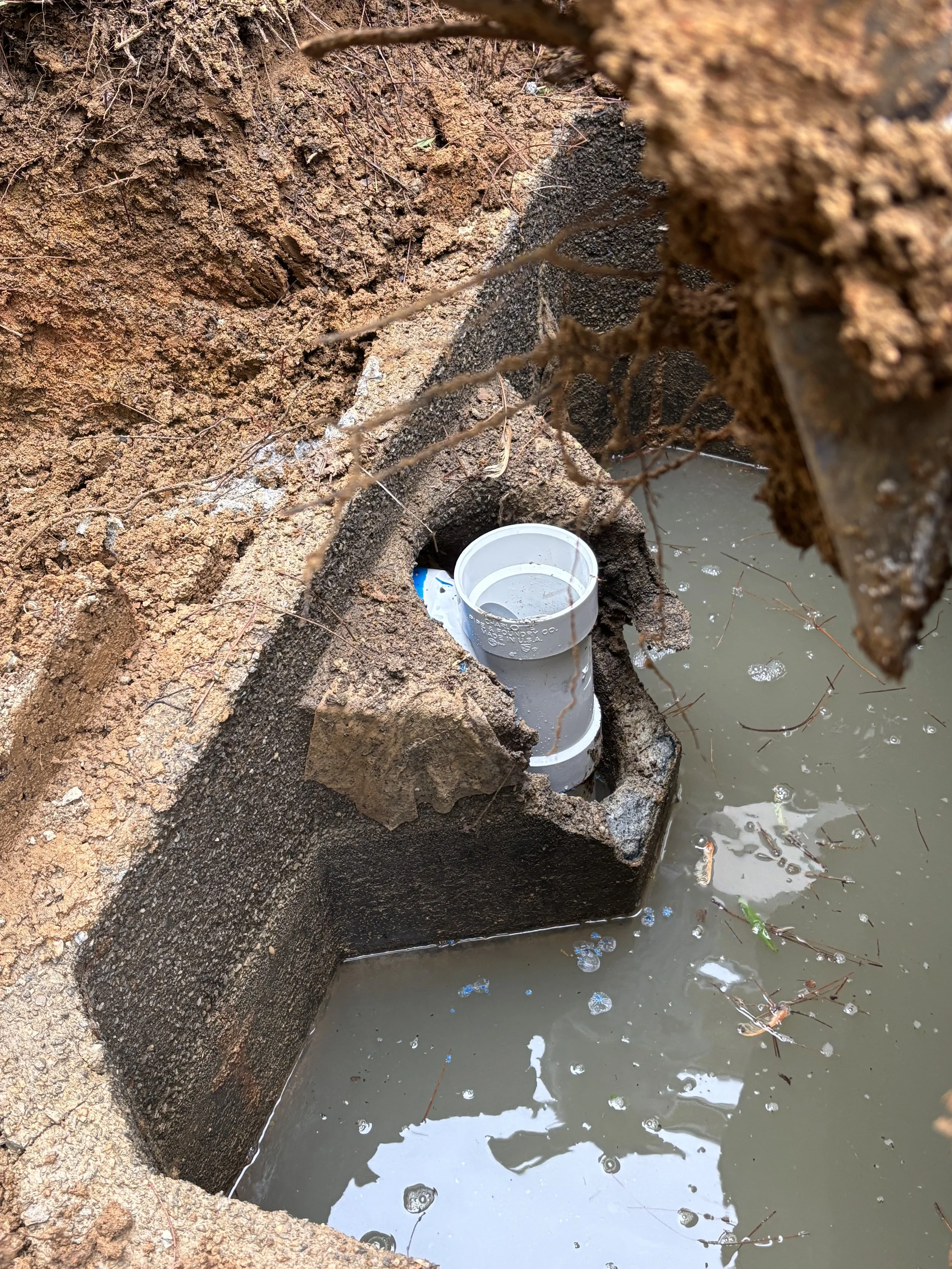 A S&W Septic service truck and mini-excavator at a residential property in Kingston, GA. We specialize in septic system repair and maintenance , including drain field repair and emergency services for issues like foul odors or slow drains.