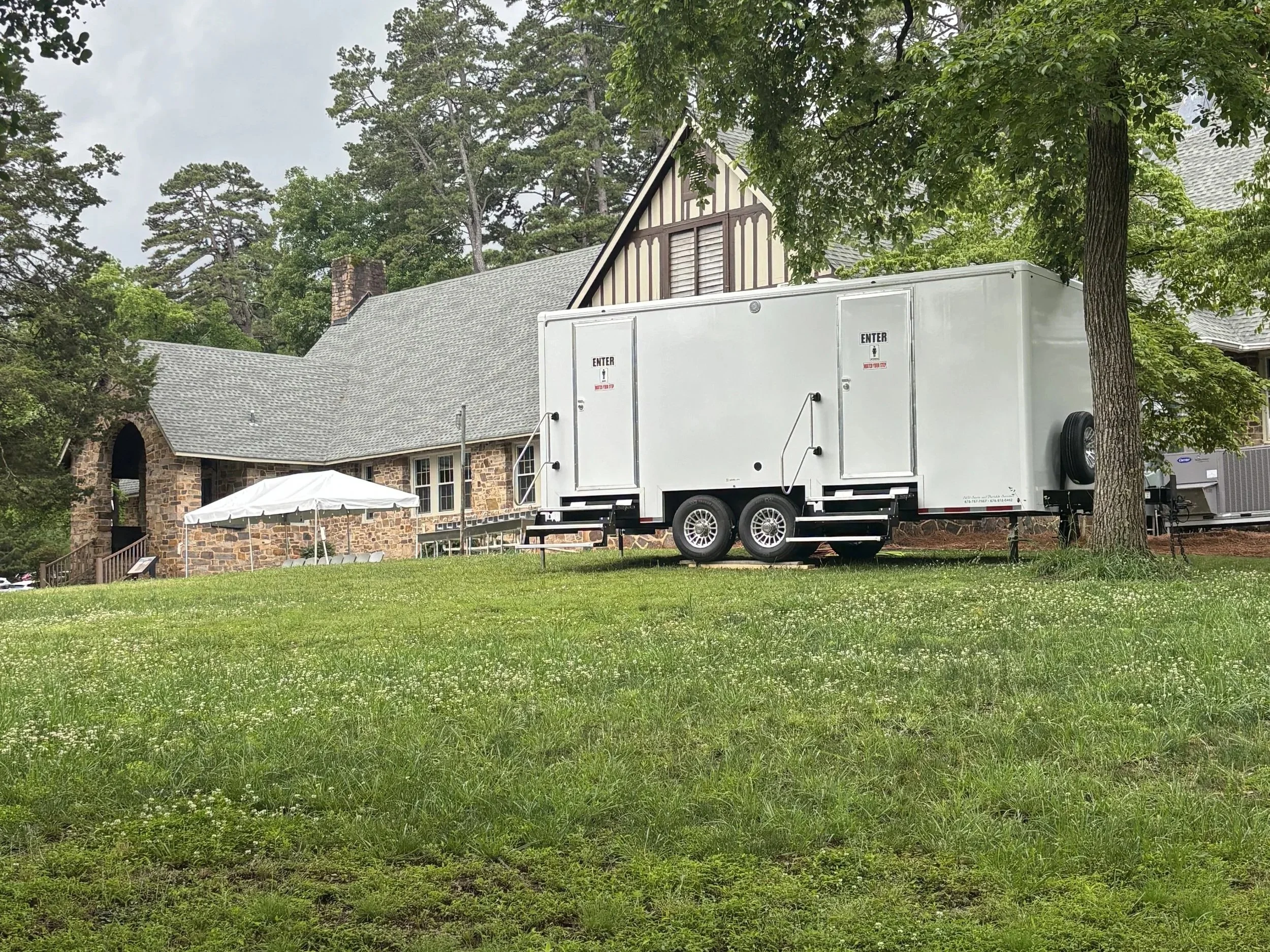 Exterior of a climate-controlled luxury restroom trailer available for special event and wedding rentals in NW Georgia.