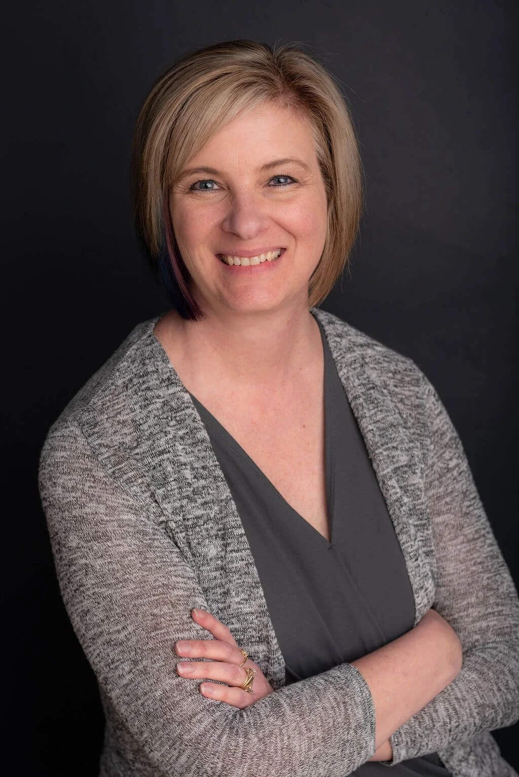 dalene higgins in grey shirt with grey cardigan