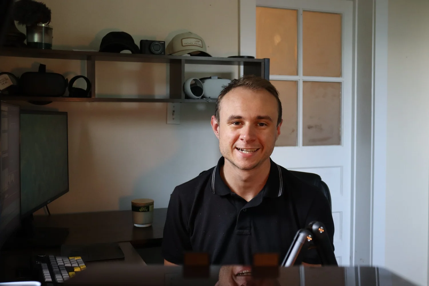 Hayden Teteak at his desk with a camera and microphone
