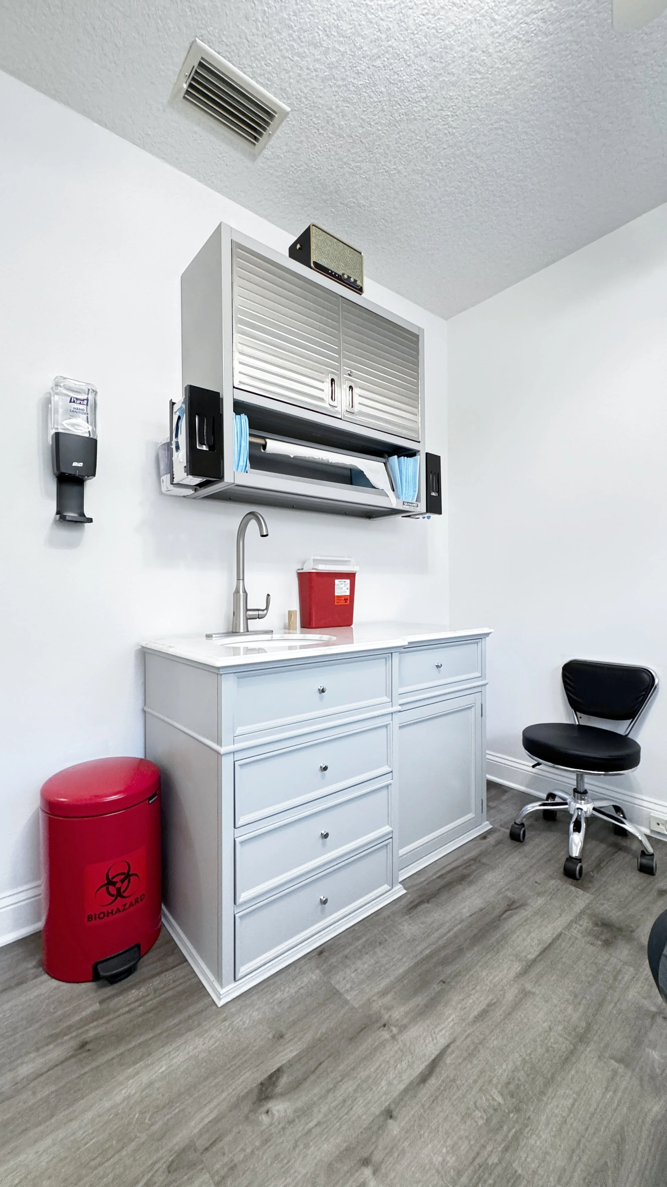 Photo of the doctor's room containing cabinetry of tools and supplies