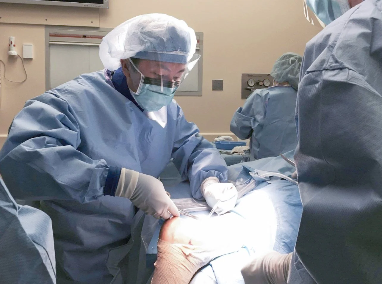 Photo of a doctor performing foot surgery