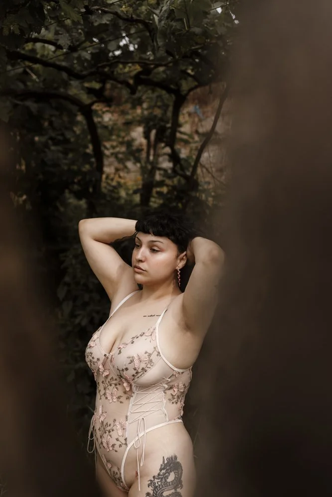 Intimate outdoor boudoir image of Margarida in the forest captures natural beauty, confidence, and a sophisticated boudoir aesthetic.