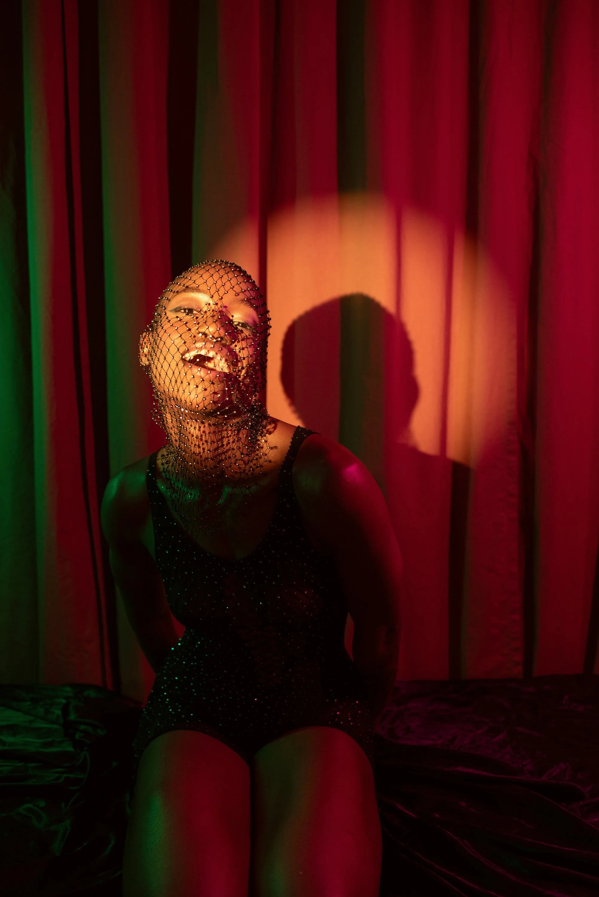 Boudoir Neon session with Djau, showcasing bold lighting and elegant pose.