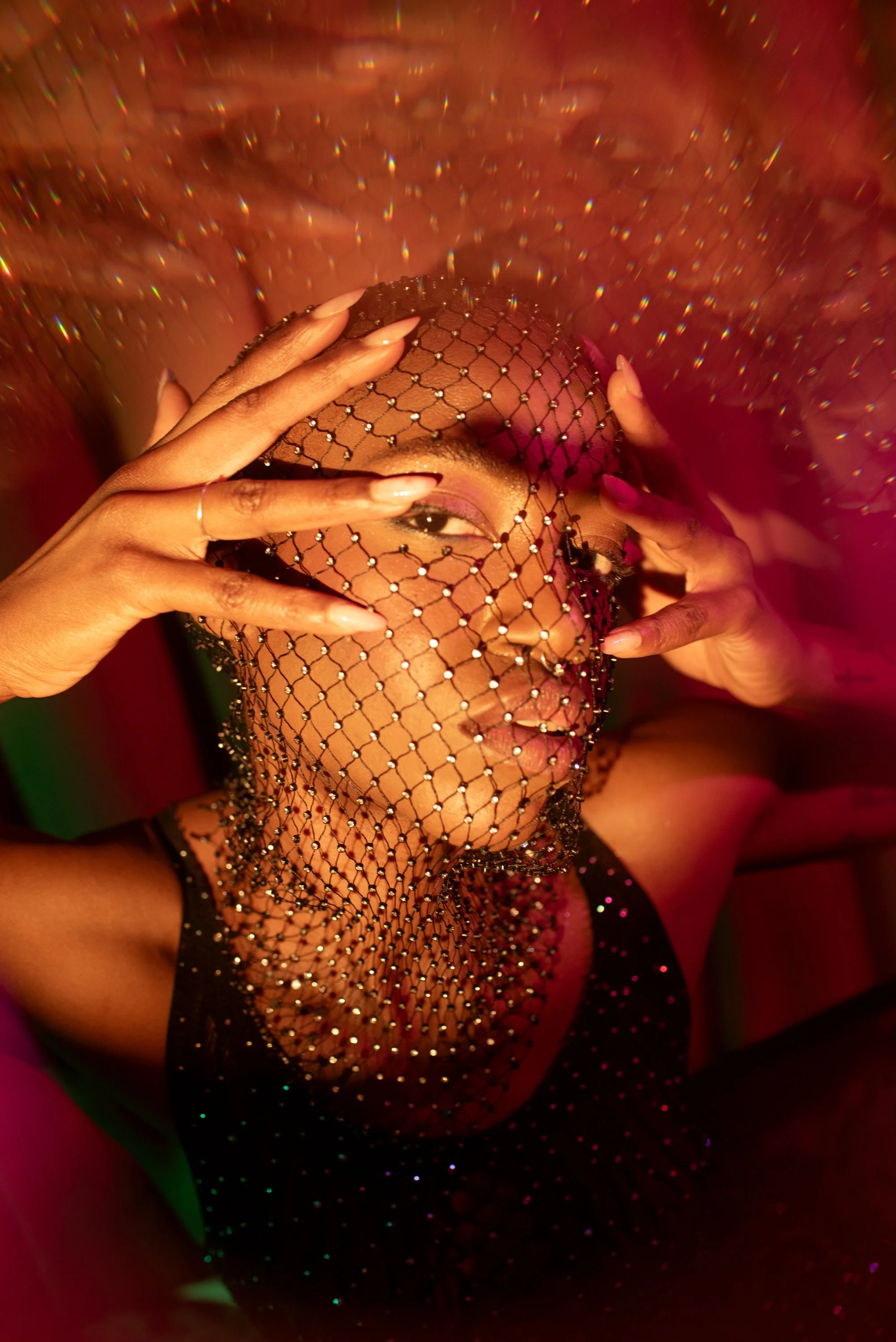 Boudoir Neon session with Djau, showcasing bold lighting and elegant pose.