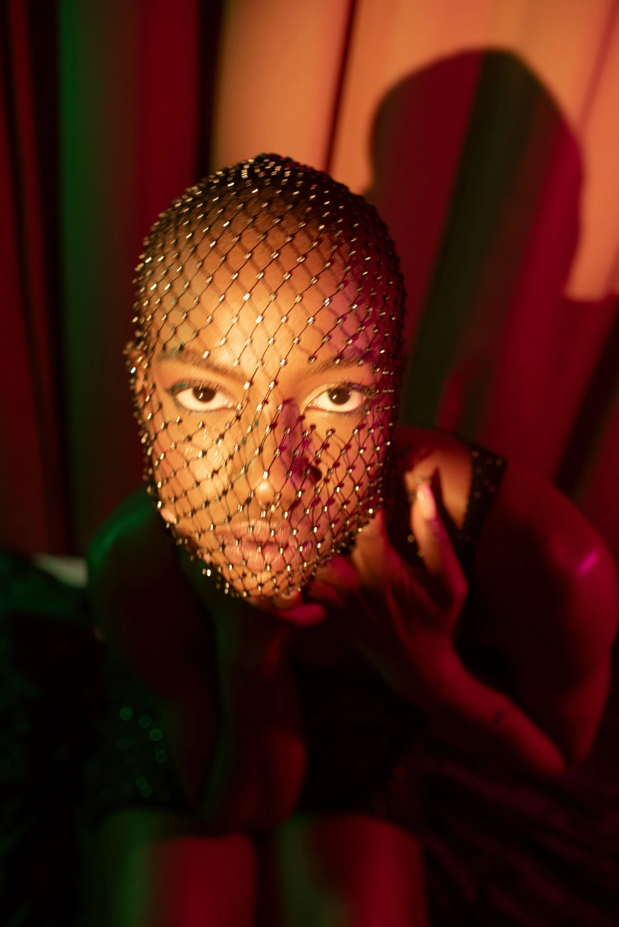 Boudoir Neon session with Djau, showcasing bold lighting and elegant pose.