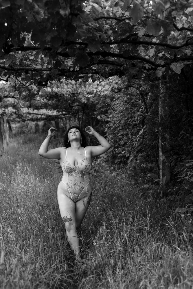 Intimate outdoor boudoir image of Margarida in the forest captures natural beauty, confidence, and a sophisticated boudoir aesthetic.