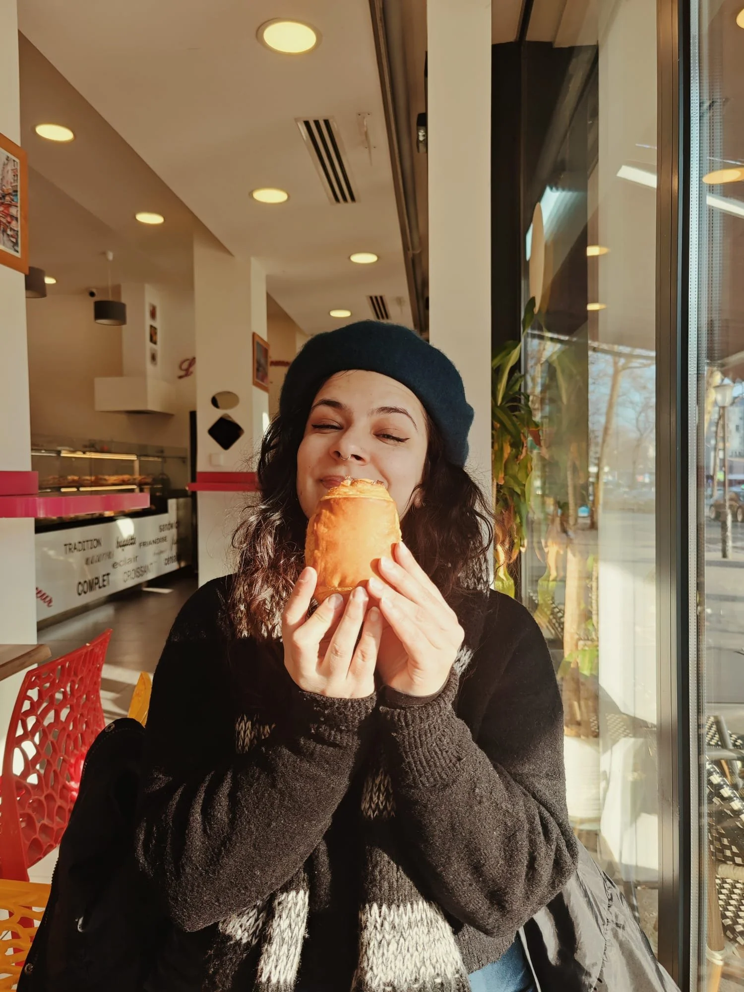 girl holding a pan au chocolat