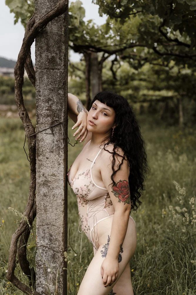 Intimate outdoor boudoir image of Margarida in the forest captures natural beauty, confidence, and a sophisticated boudoir aesthetic.