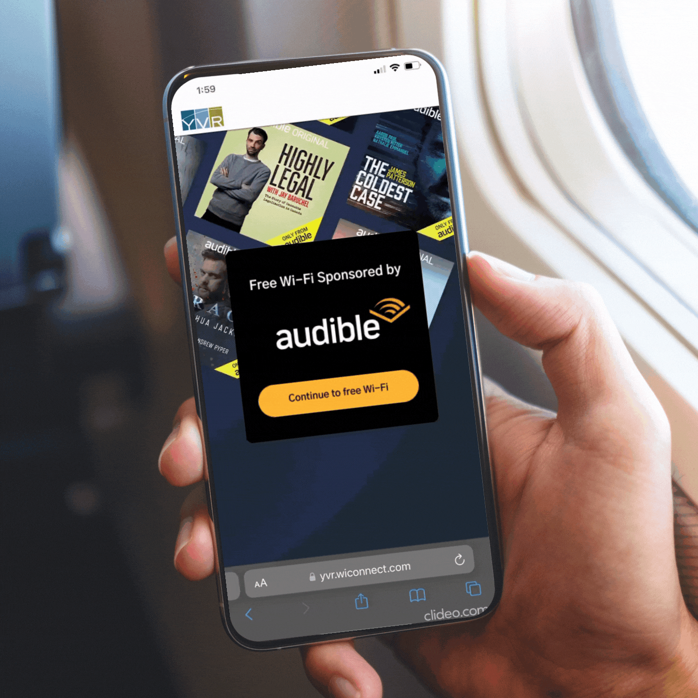 Hand holding a smartphone inside an airplane, showing a screen with various audiobook covers and a pop-up ad for free Wi-Fi sponsored by Audible, with a button to continue to free Wi-Fi.