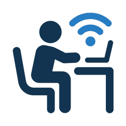 Icon of a person sitting at a desk using a laptop with Wi-Fi signals above
