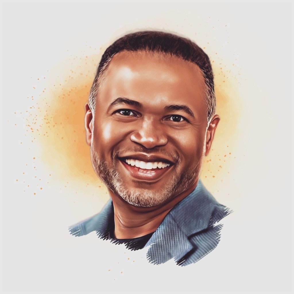 A smiling man with short dark hair, a beard, wearing a dark blazer over a dark shirt, with a light background and orange splashes behind him.