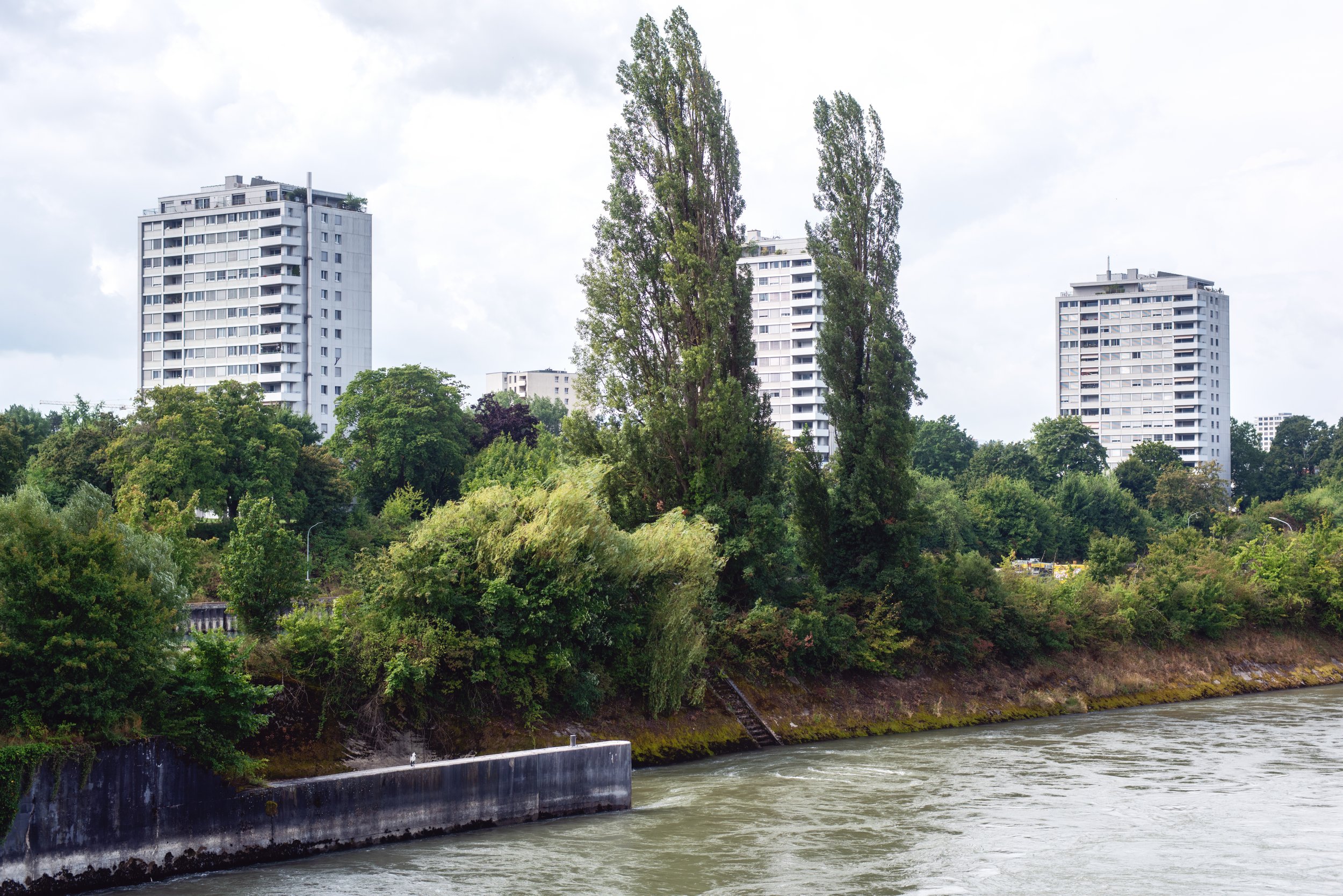  Three residential buildings and some trees seen from Kraftwerk Birsfelden 