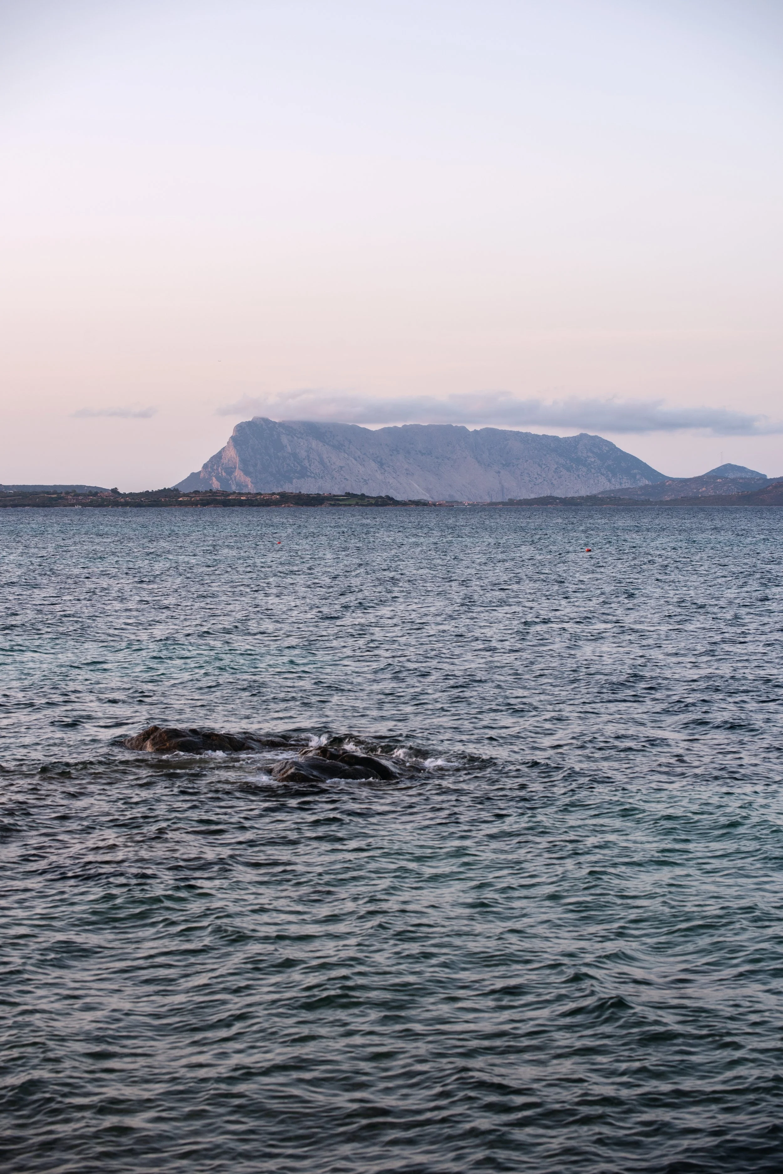  mediterranean sea at sunset with a view of Isola Tavolara 