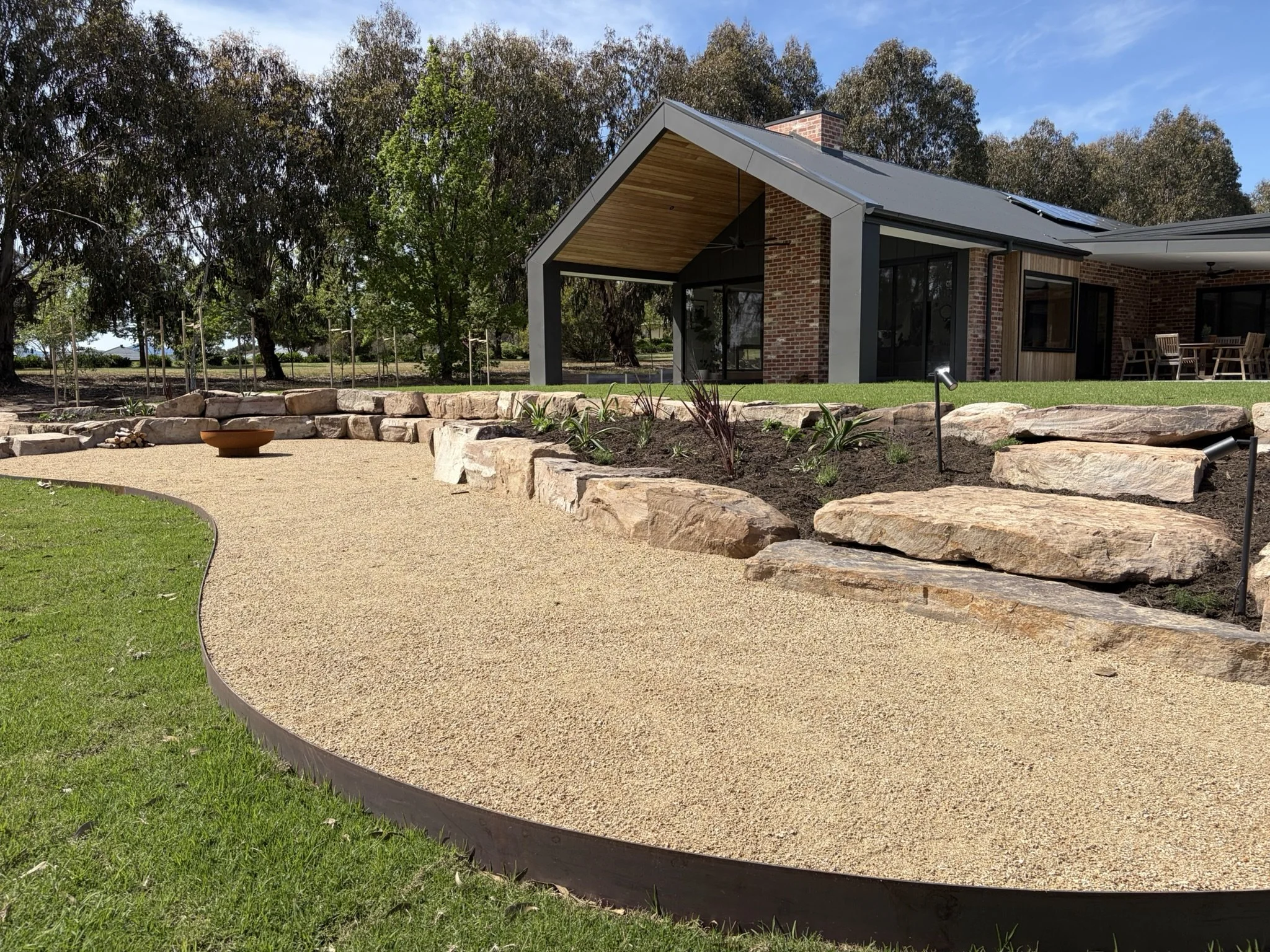 steel edging, fire pit, stone steps.jpeg