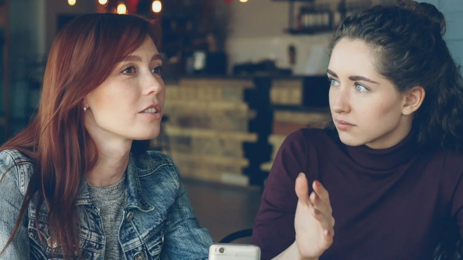 Two women talking about voting.