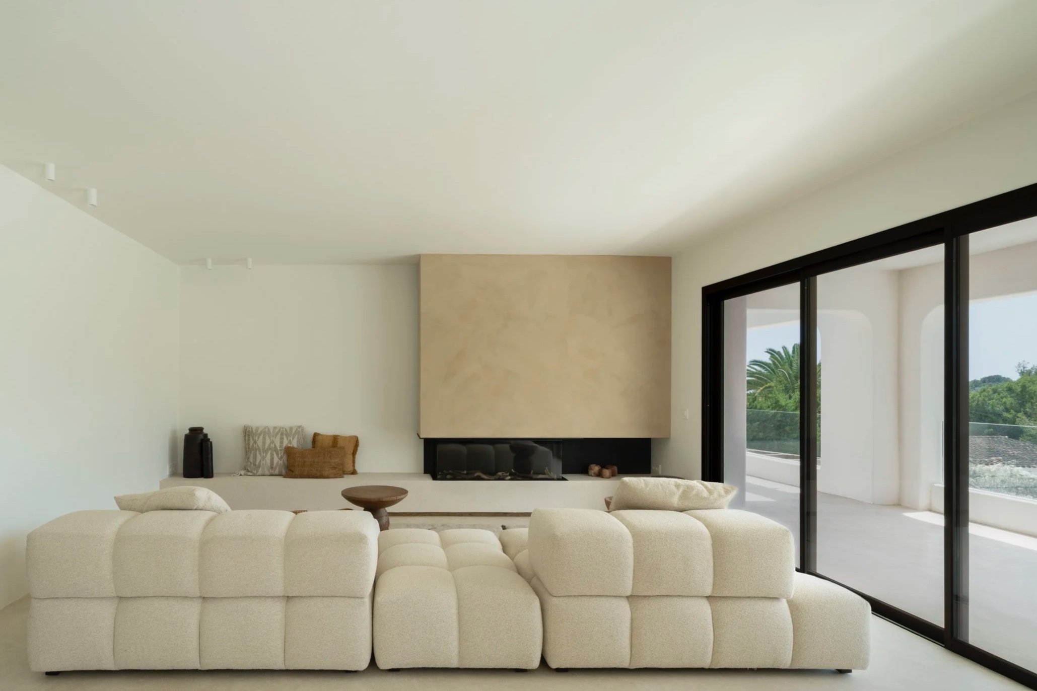 Cosy element couch at the fireplace with decorative elements 
