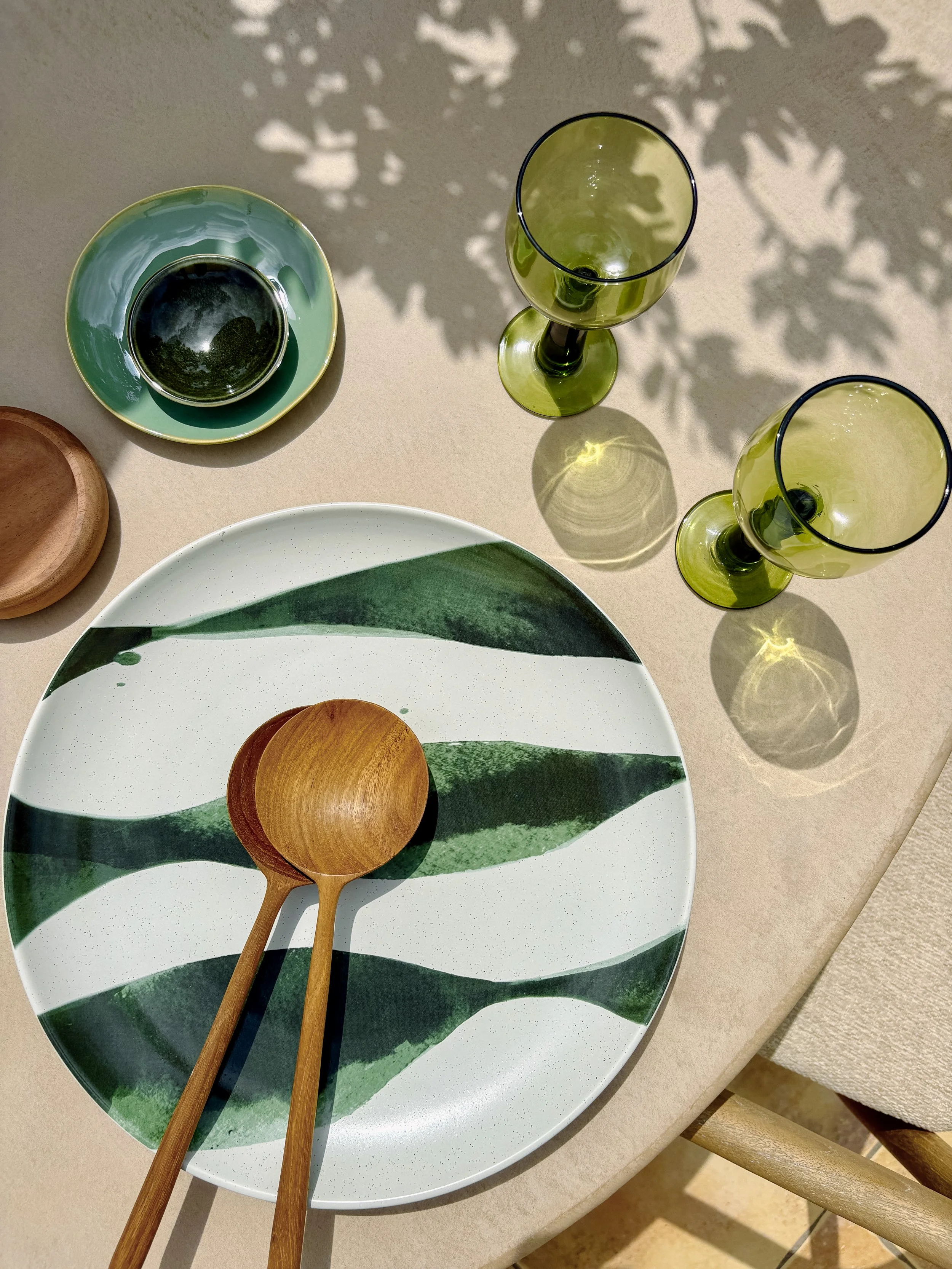 Green Ceramics with wooden spoons that make every gathering feel good. 