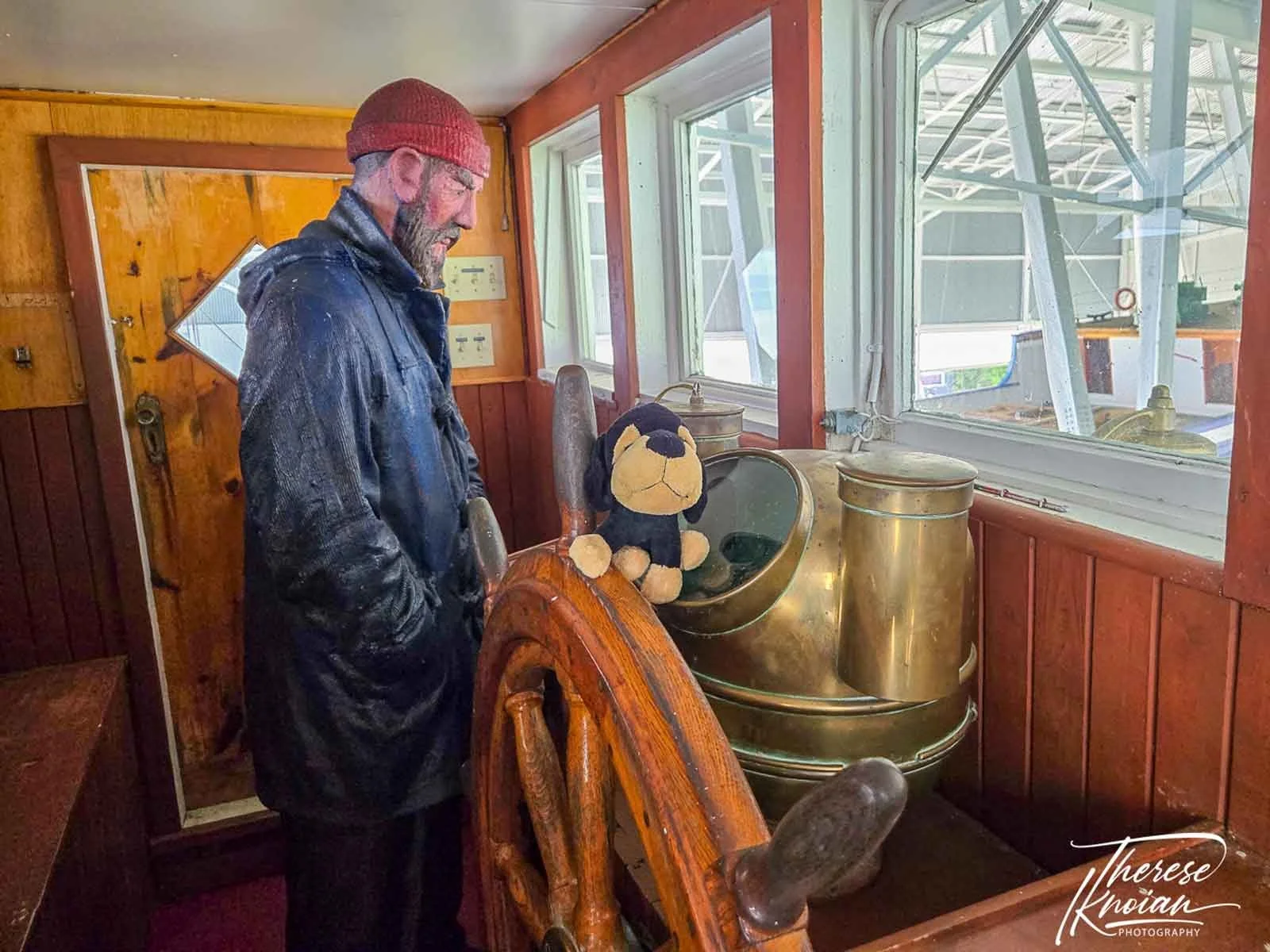 Maurice our stuffed dog sits in a display at the Maritime Museum in Charlevoix.