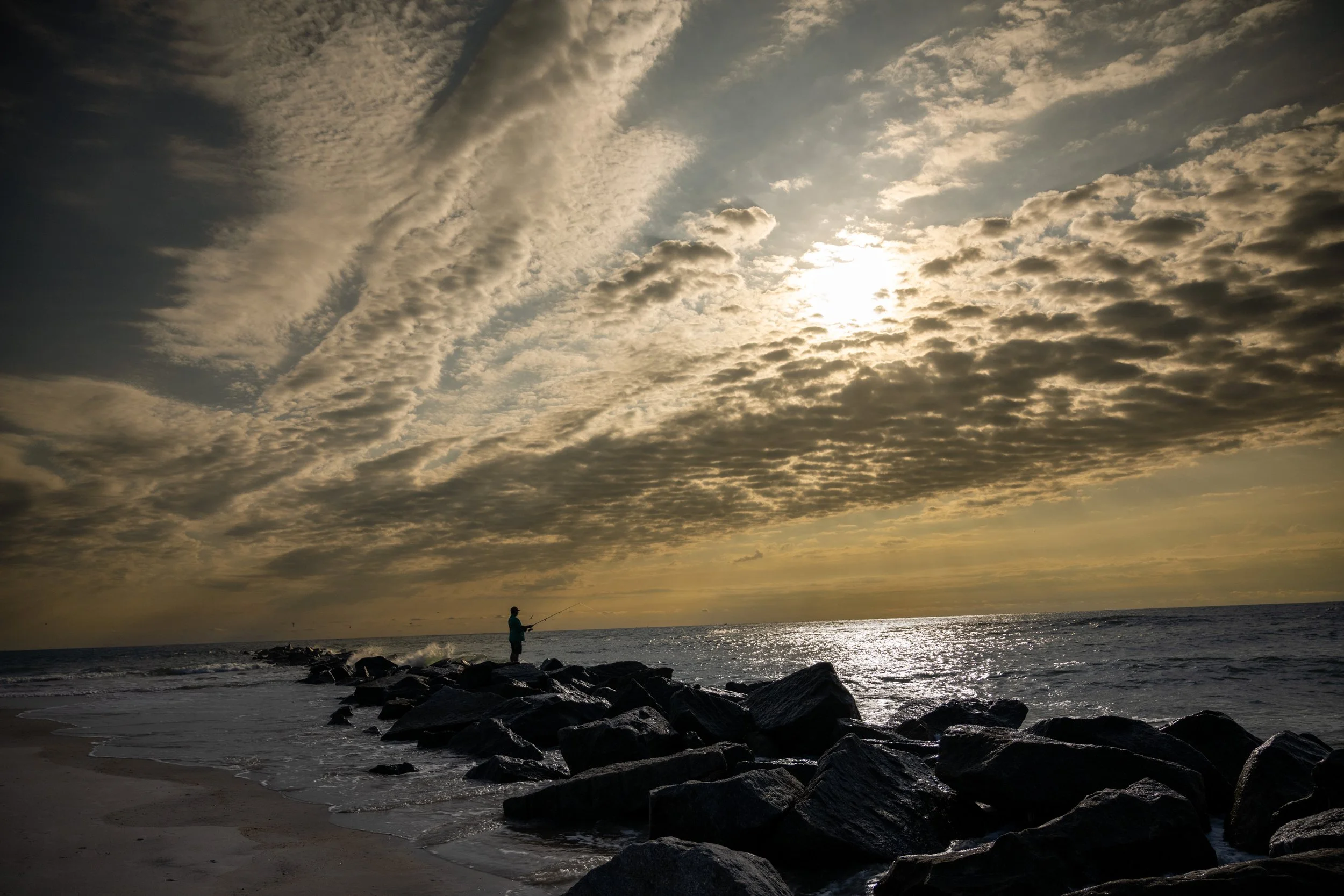 Man Fishing At Dawn