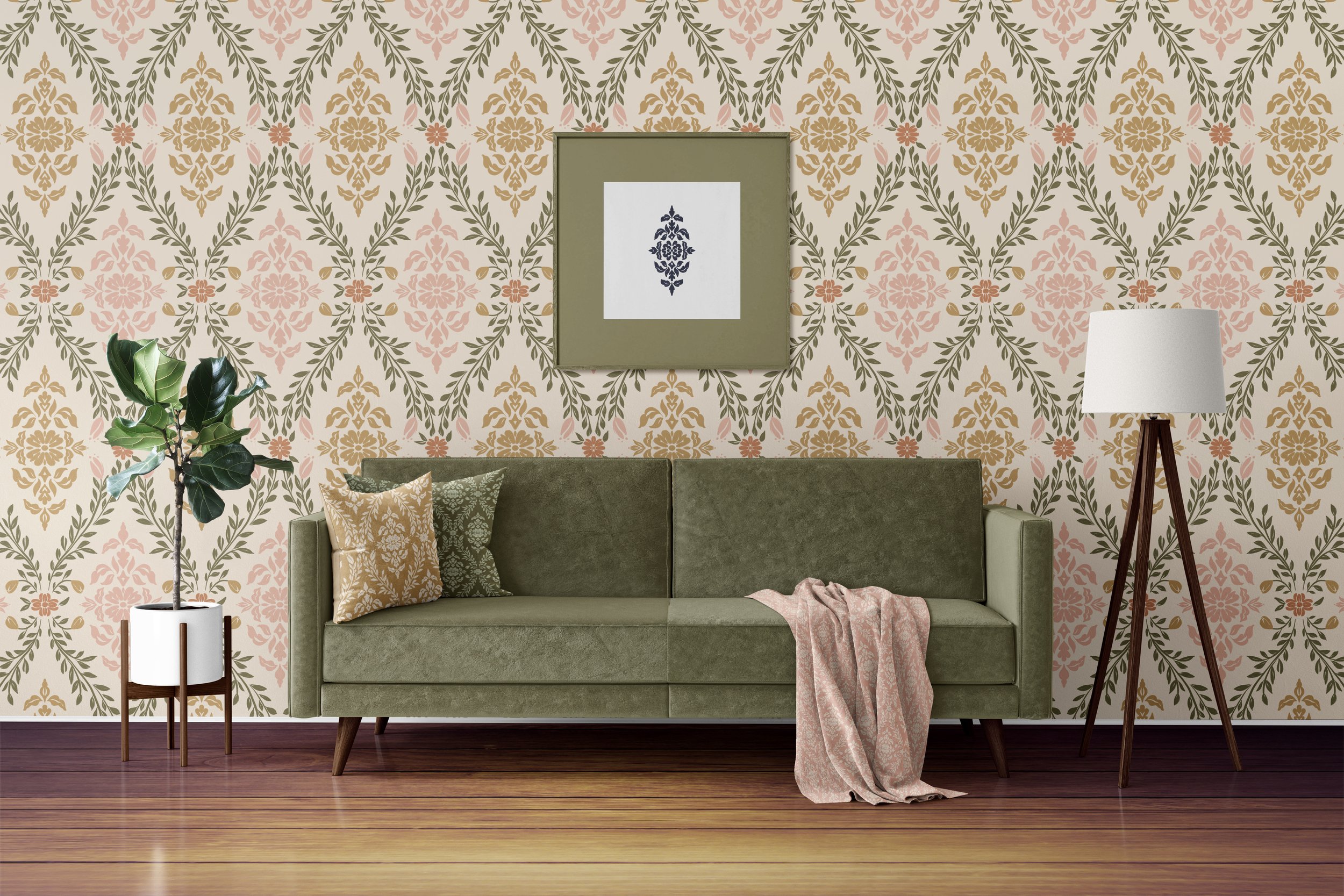 A living room with a patterned wallpaper, a green mid-century modern sofa with pillows and a pink throw blanket, a tall potted plant, a standing lamp, and wall art on the wall.