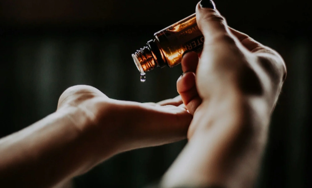 dropping essential oils on hand
