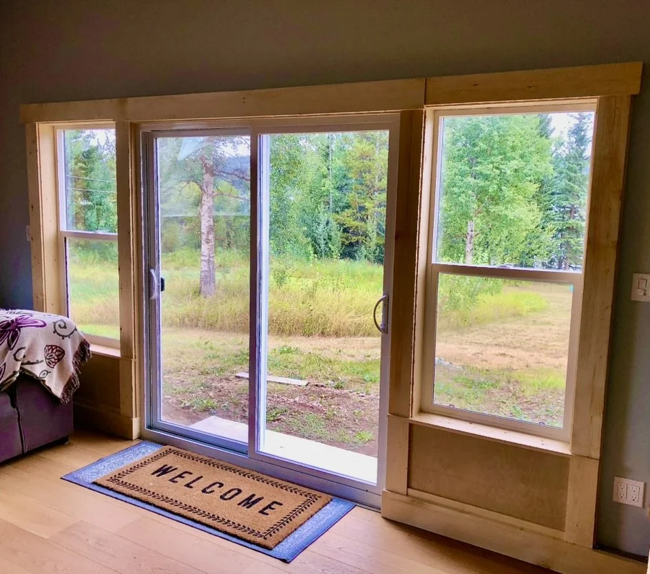 Living room: Replace single smaller window unit with new casement windows and double sliding doors to take advantage of the view, increase natural light, and to access the grass yard and deck. Reinforce the framing for increased lateral stability and