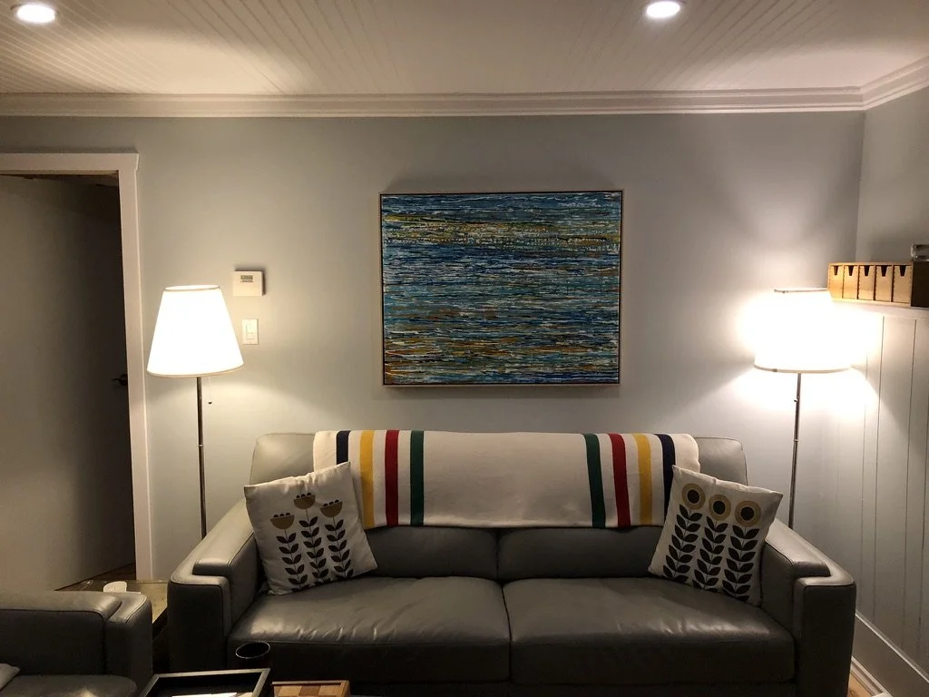 Basement Suite - Living Room: Replace existing T-Bar ceiling with coffered ceiling using beadboard paneling and custom moldings and LED ceiling lighting throughout basement suite common areas. Engineered flooring damp-rated throughout. 