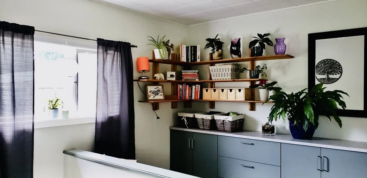 Entry way with custom corner shelf unit, new prefab narrow cabinets and counter.