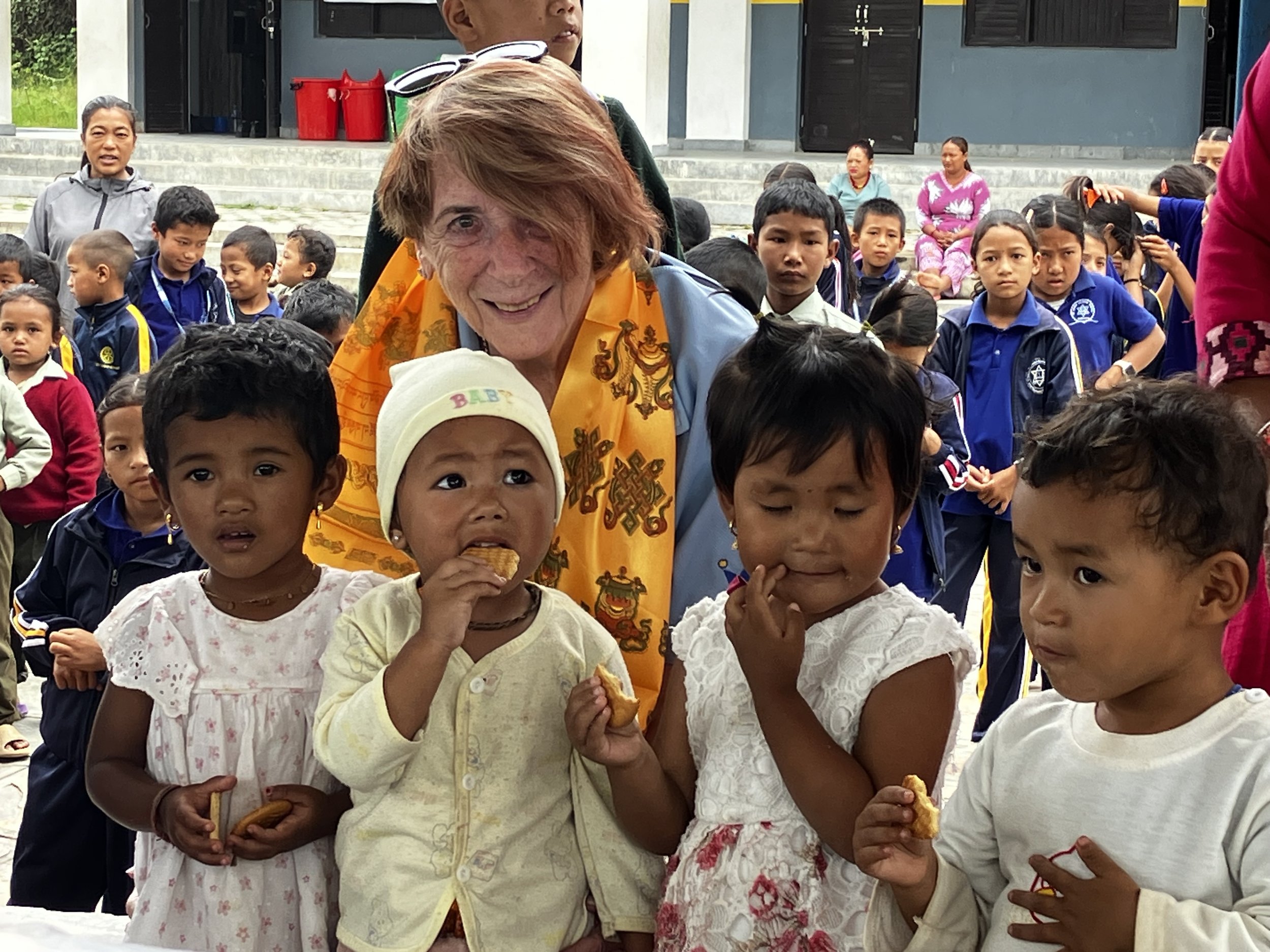 Rotary volunteer with 4 newys.JPG