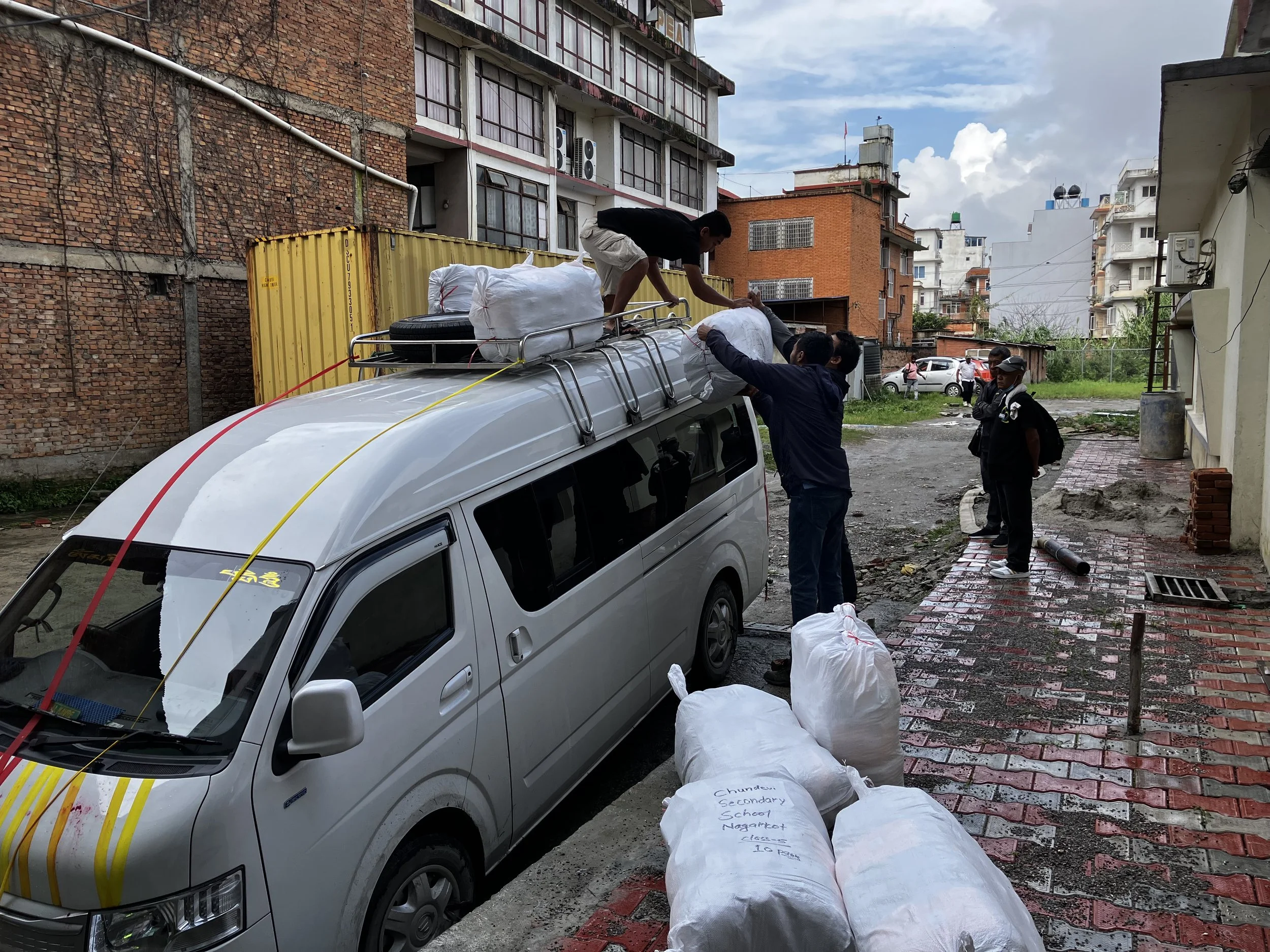 loading the uniforms for another school.JPG