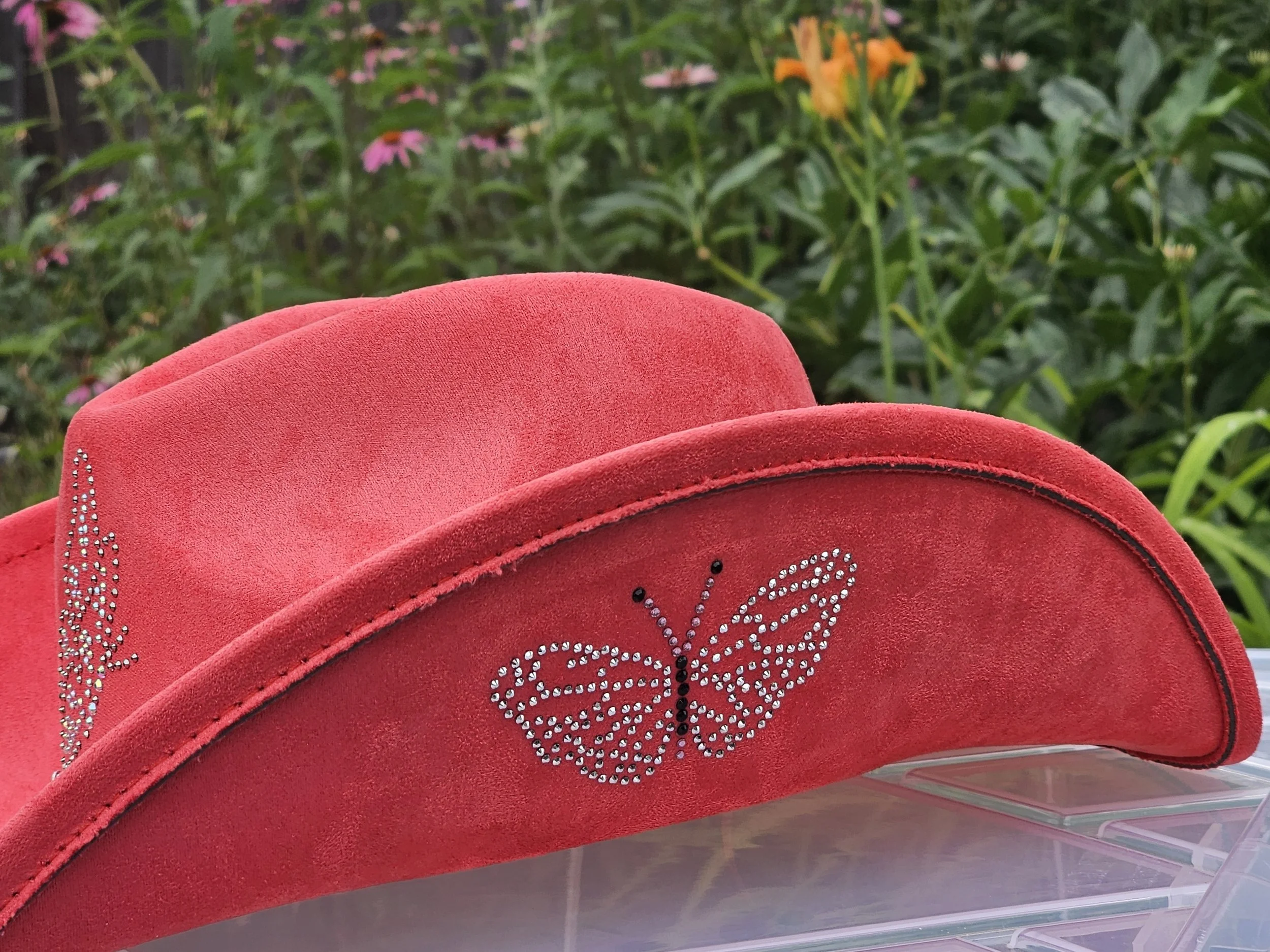 Red suede wide-brim hat with rhinestone butterfly and embellishments.  Rhinestone template created by Elemental Vibes.  Custom rhinestone templates upon request.