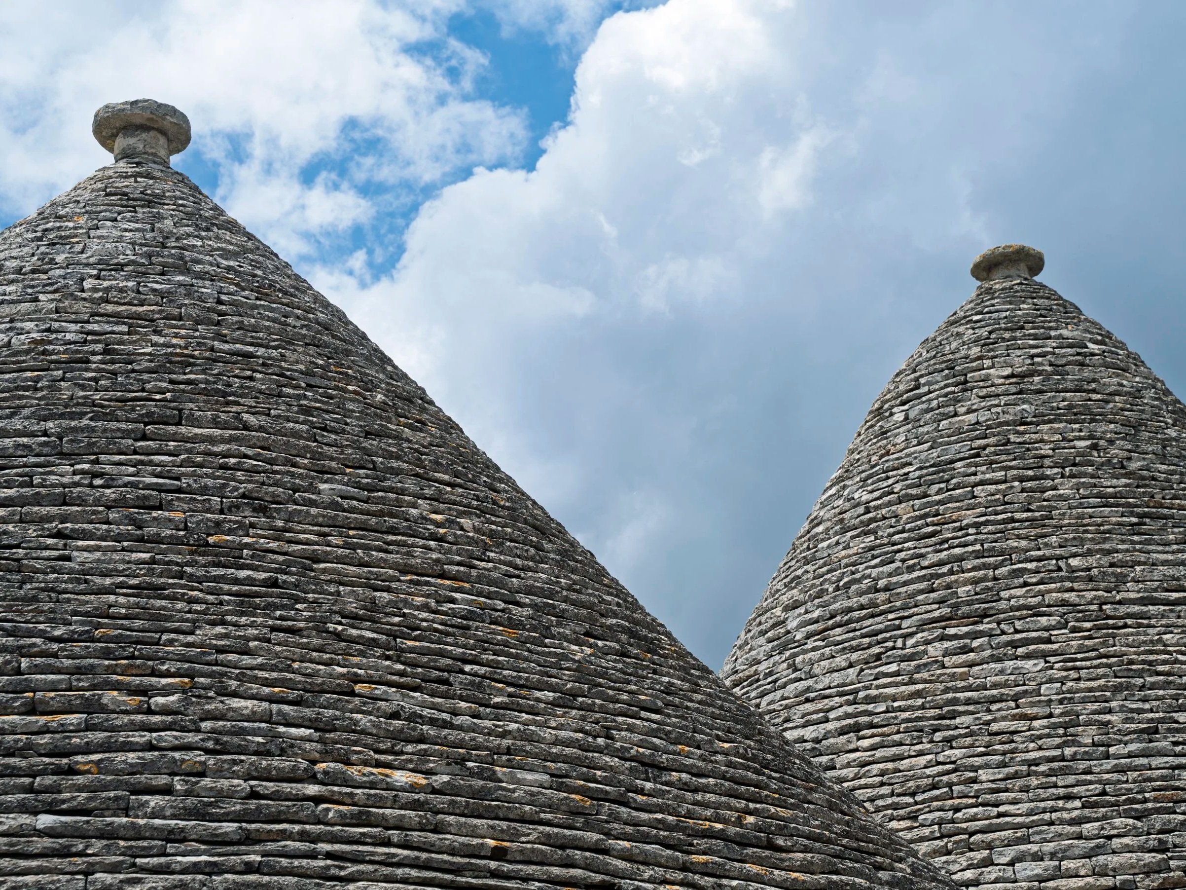 'Iconic Dry-Stone Trulli Roofs Against the Puglian Sky' Italy