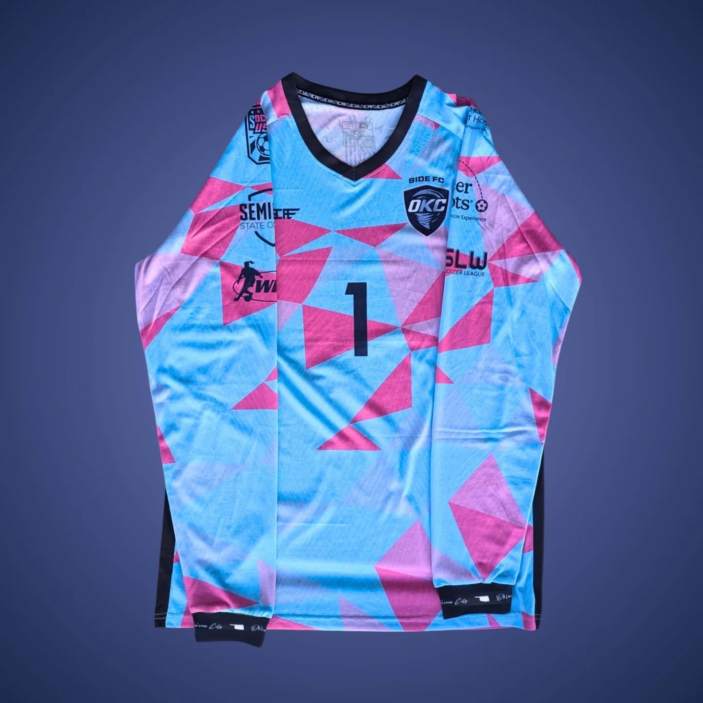 Pink and blue goalkeeper jersey