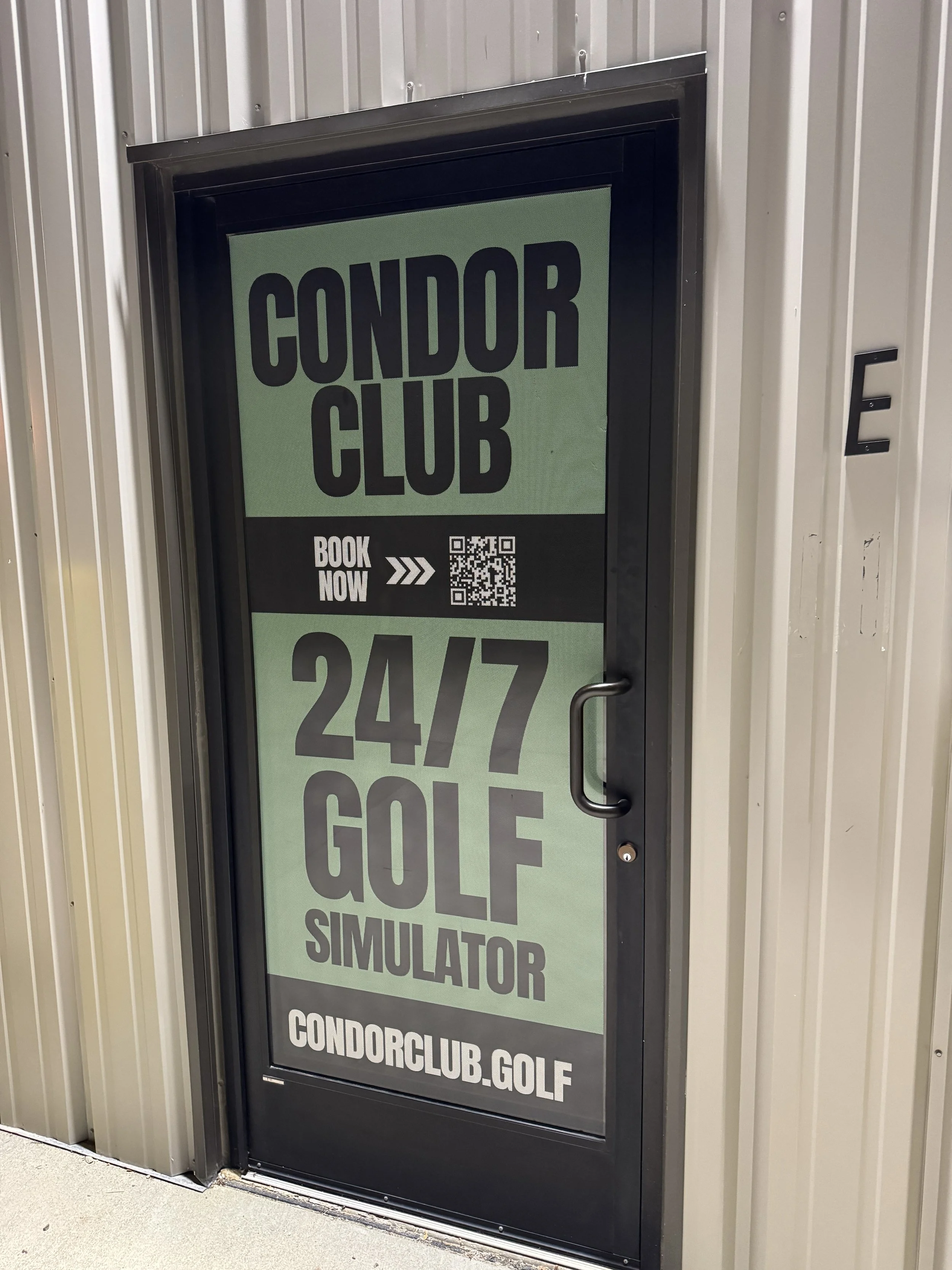 Door advertising Condor Club's 24/7 golf simulator with book now option, QR code, and website condorclub.golf.