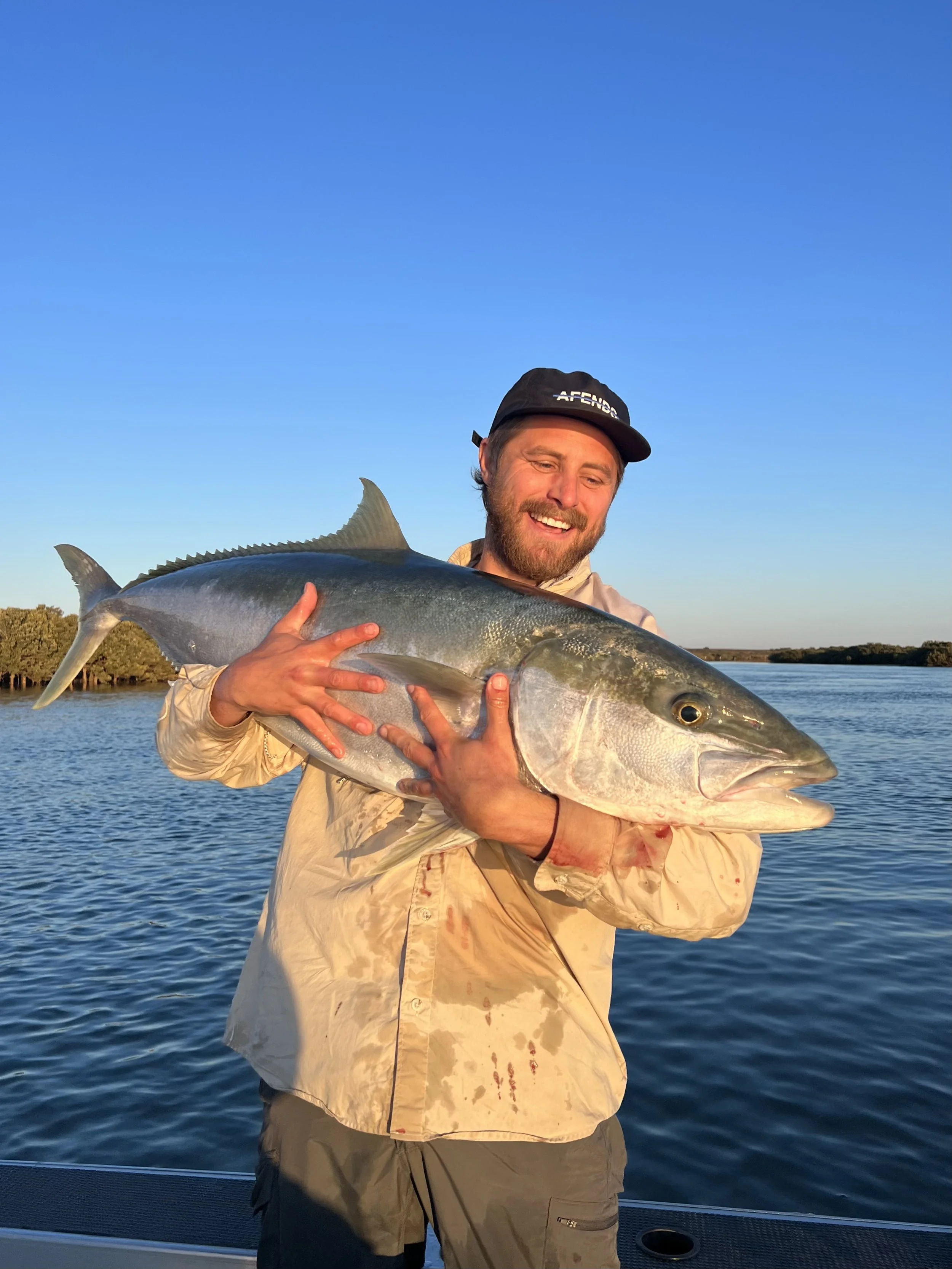 Angus Kyffin Kingswood Kelly, founder of Kyffin Productions, holding a large kingfish — About page
