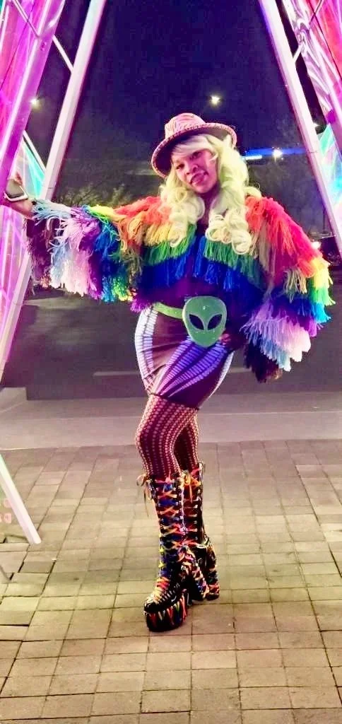 ArandomLady aesthetic muse rainbow jacket alien Area 15 Las Vegas festival wear 