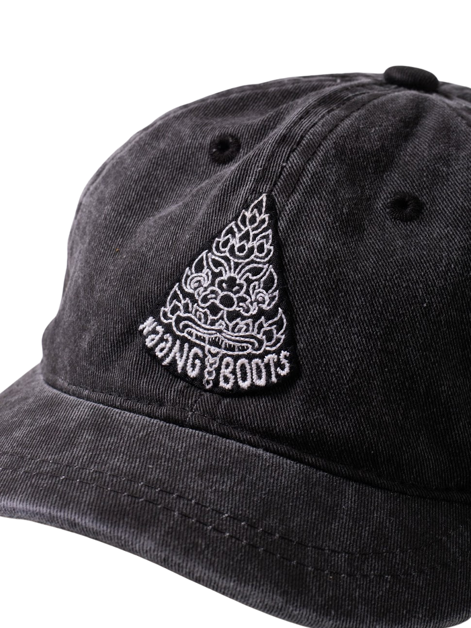 close up of Short brim black denim hat with hand embroidered Naang Boots Logo