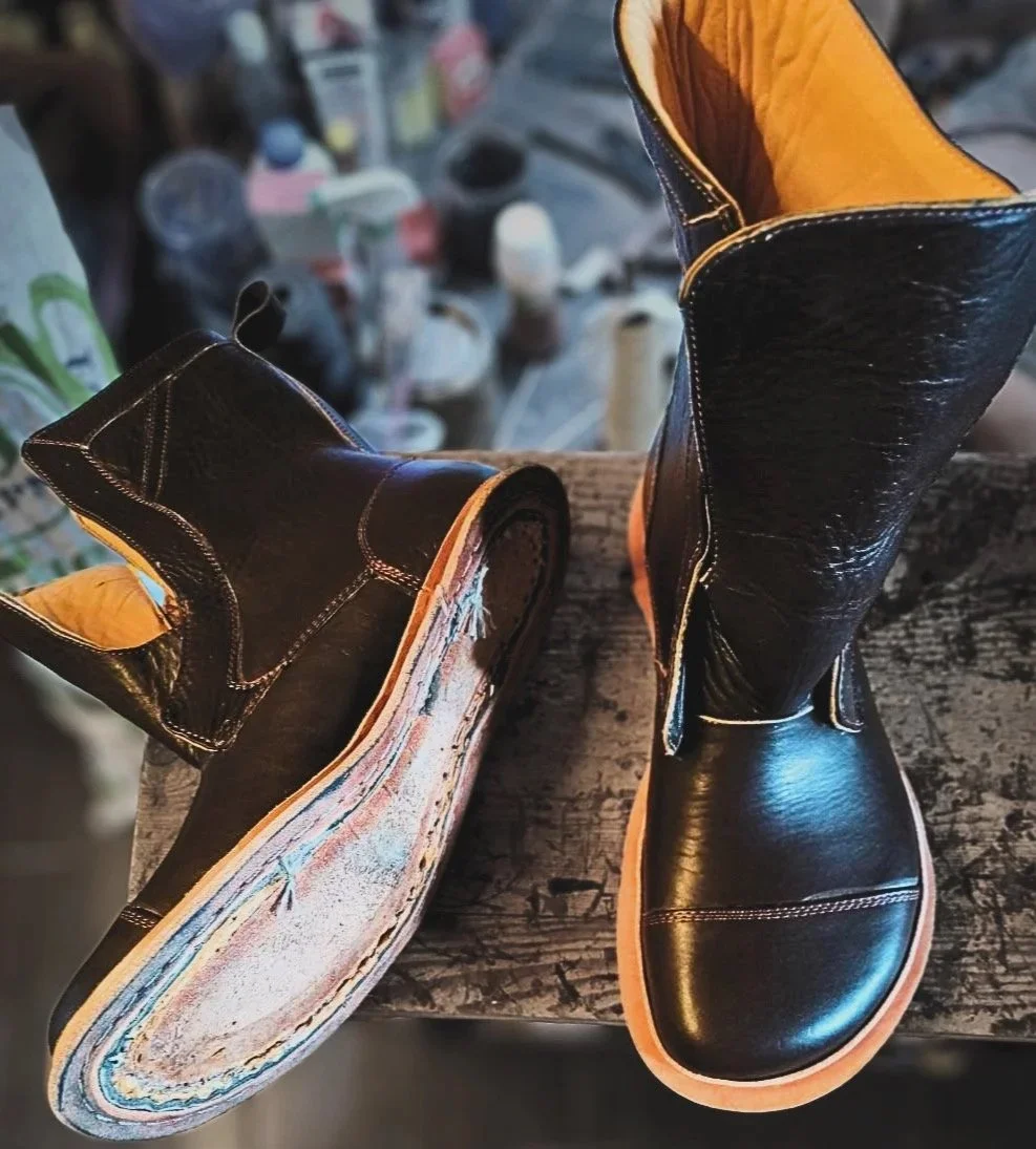 a pair of 360 degree welted boots