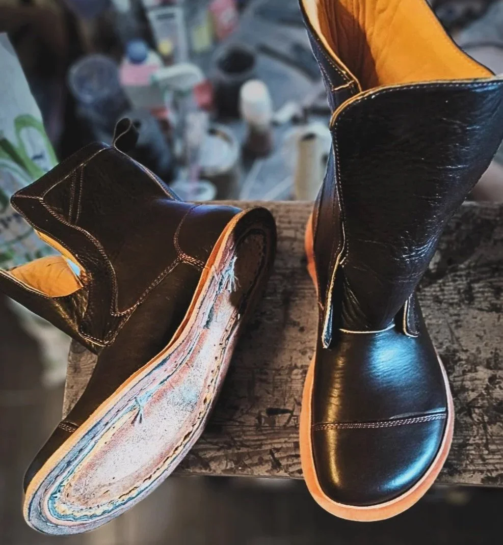 a pair of 360 degree hand welted boots being built