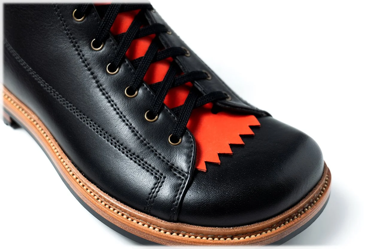 Orange Kiltie on a Black Boot
