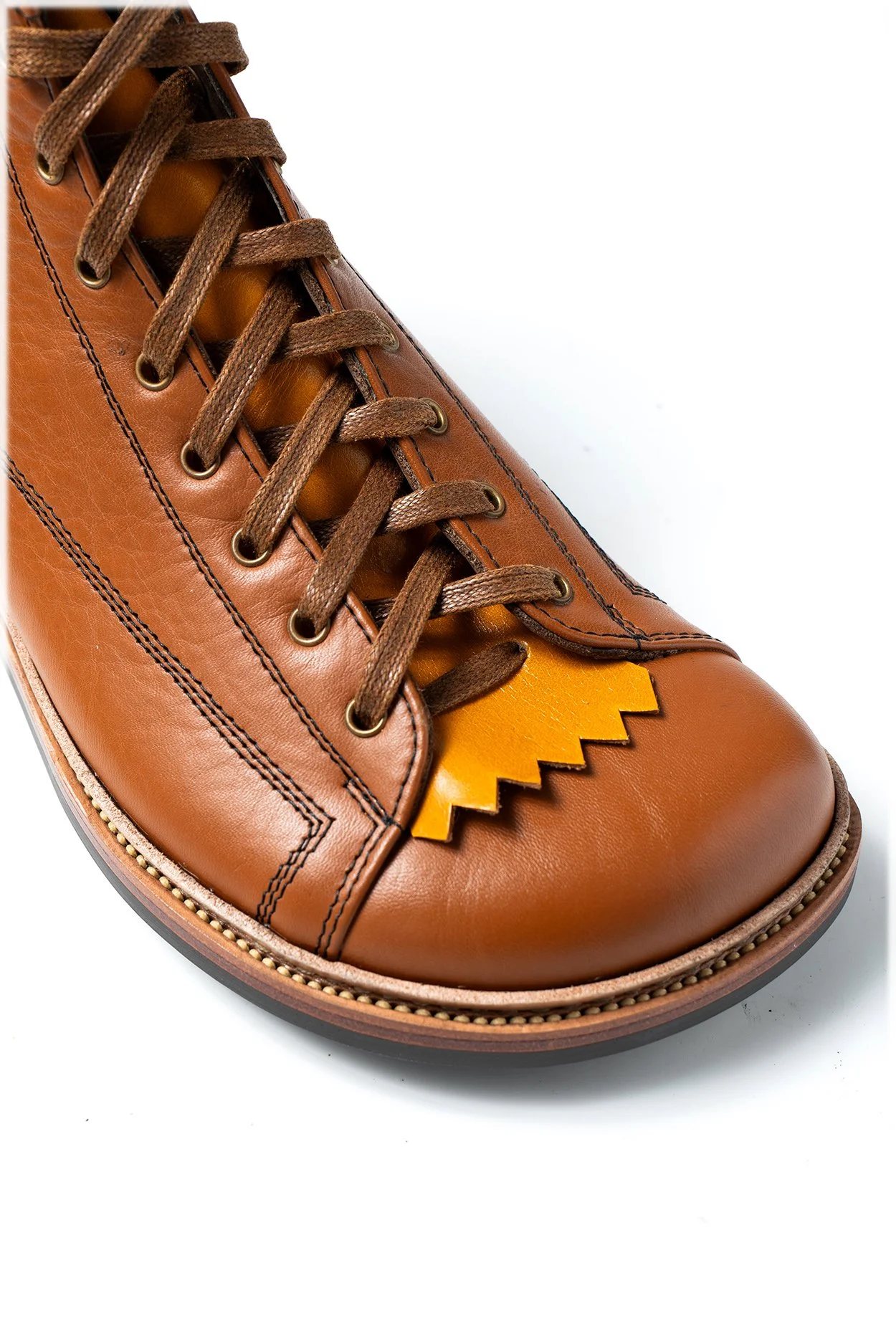 Tan Kiltie on a Mid Brown Hiking Boot To Protect the Tongue