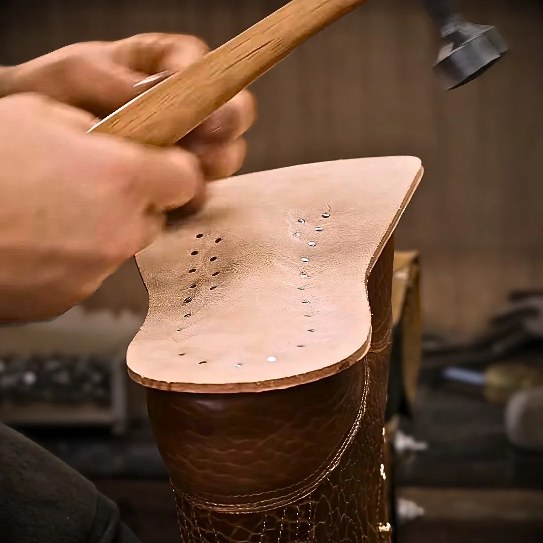 Many nails being driven into the midsole of a PNW boot