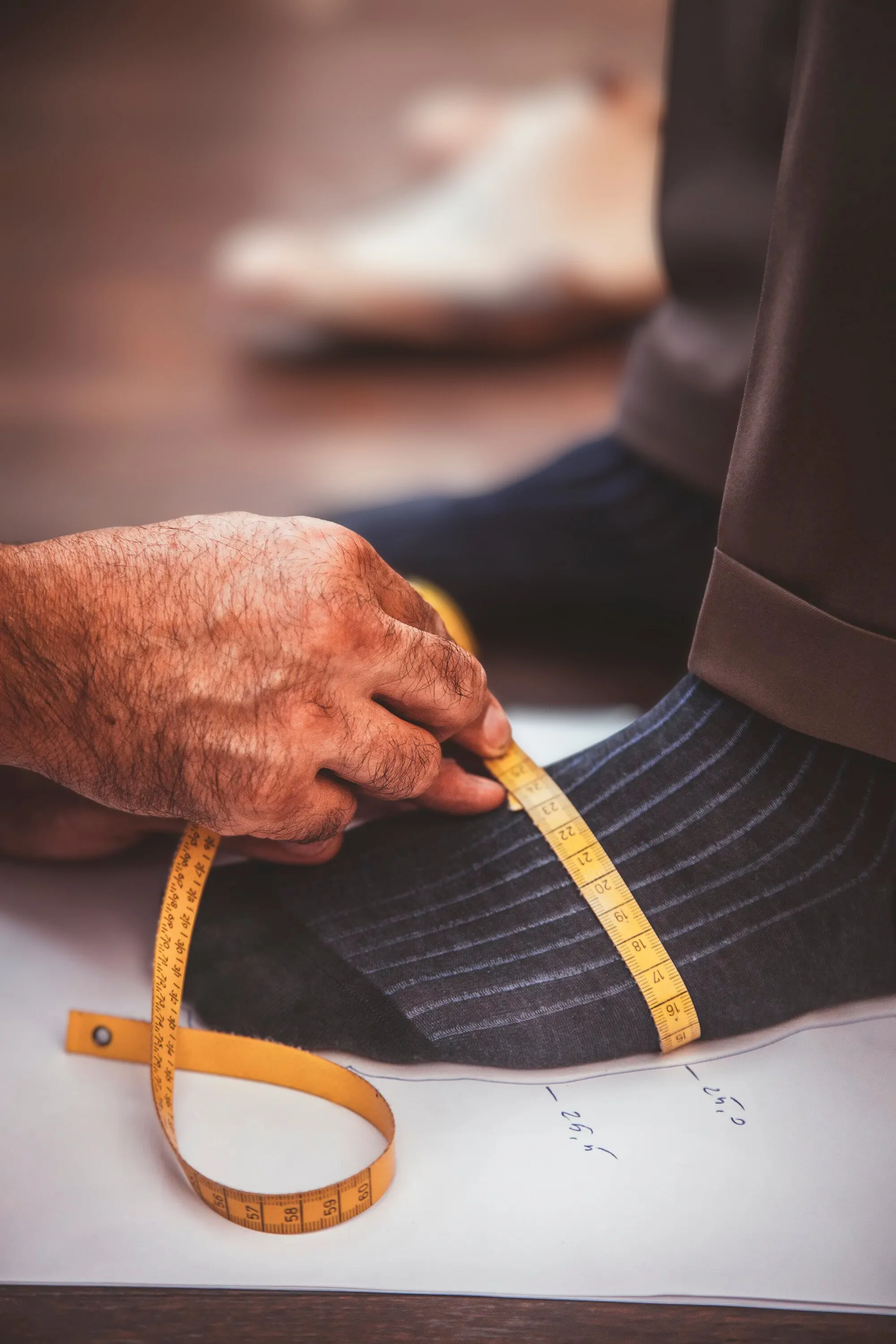 A custom boot fitting checking the foots volume