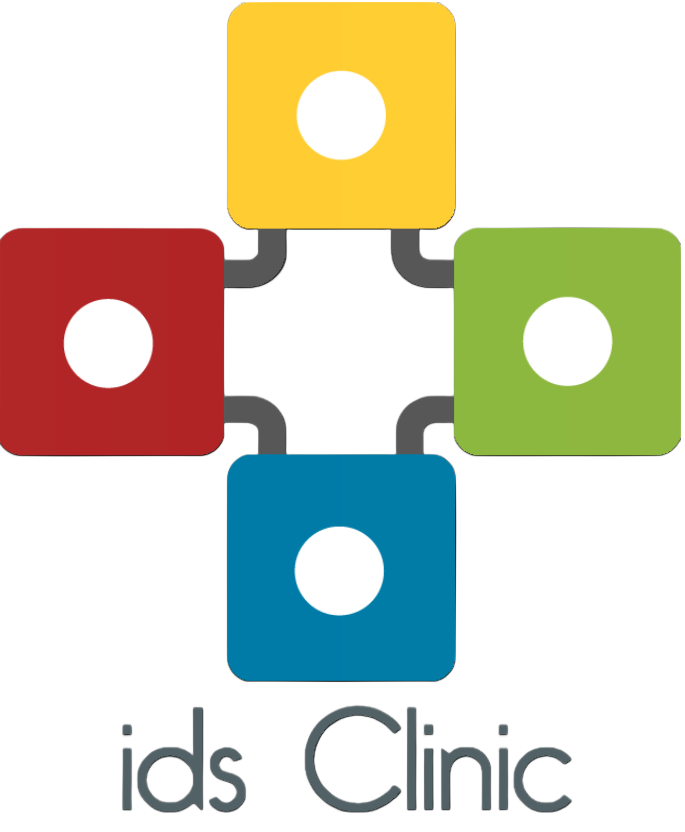 A logo for an organization called 'ids Clinic' featuring four colored squares with white circles in the center, arranged around a central black cross. The squares are yellow, red, green, and blue.