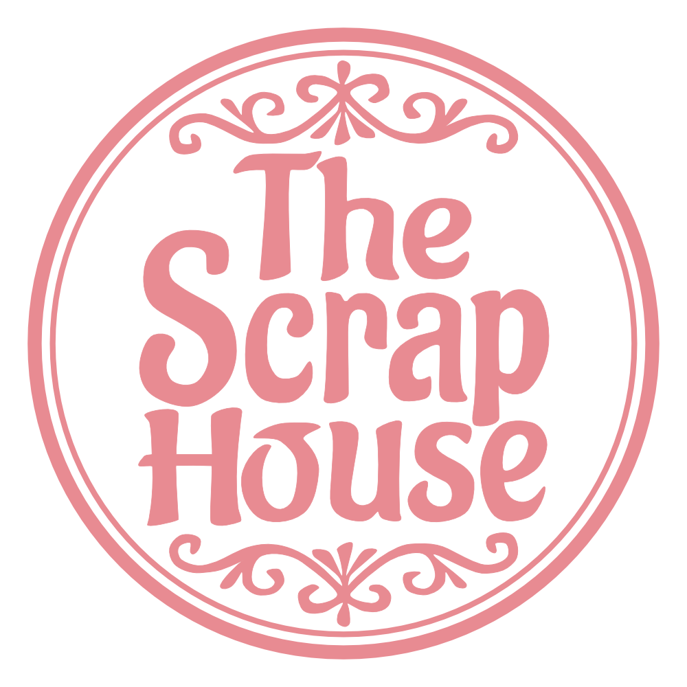 Pink circular logo with decorative border and text that reads 'The Scrap House' in a stylized font.